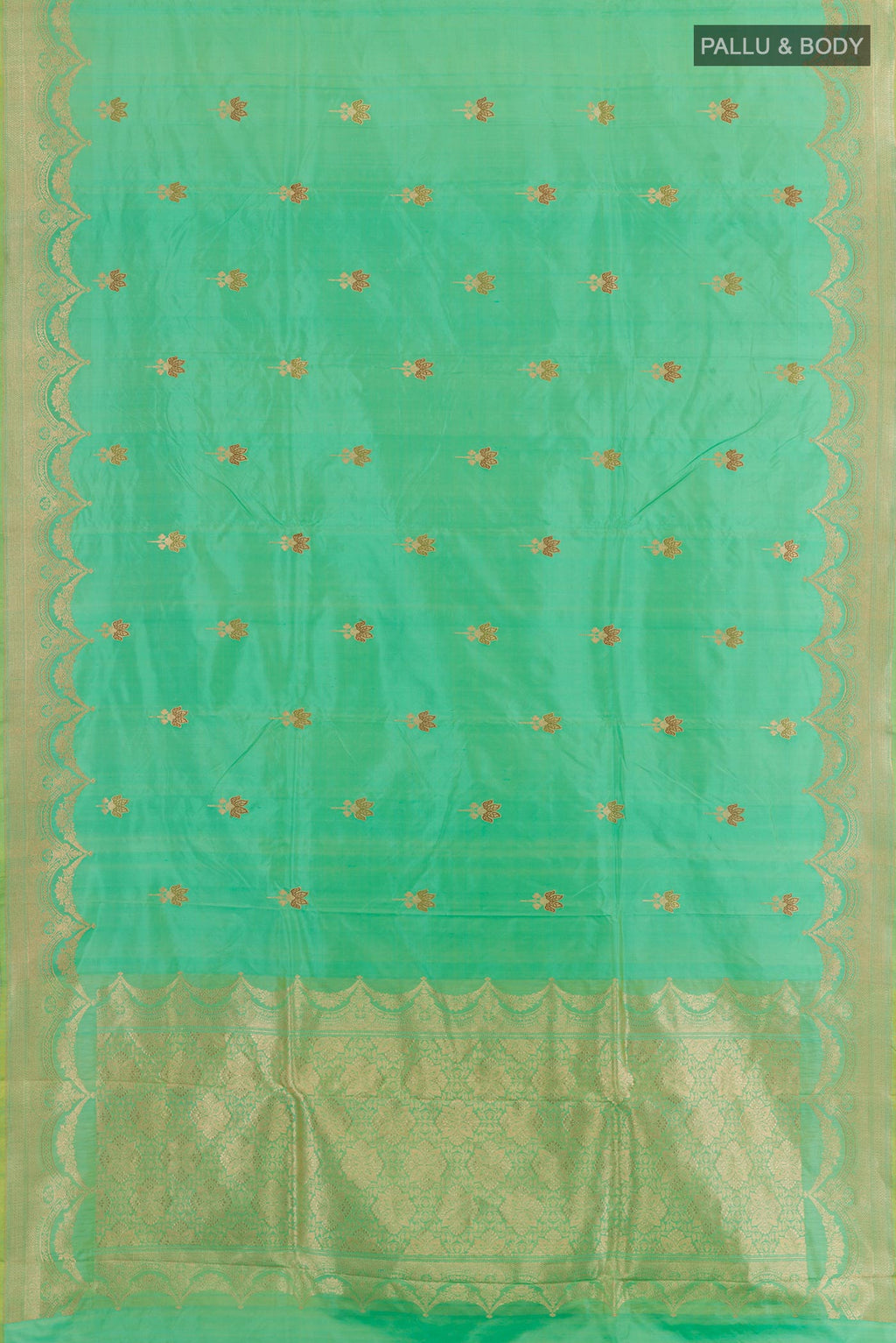 Flat view of Green Banarasi Katan Silk Saree with Zari Butta on the body and Zari Border. 