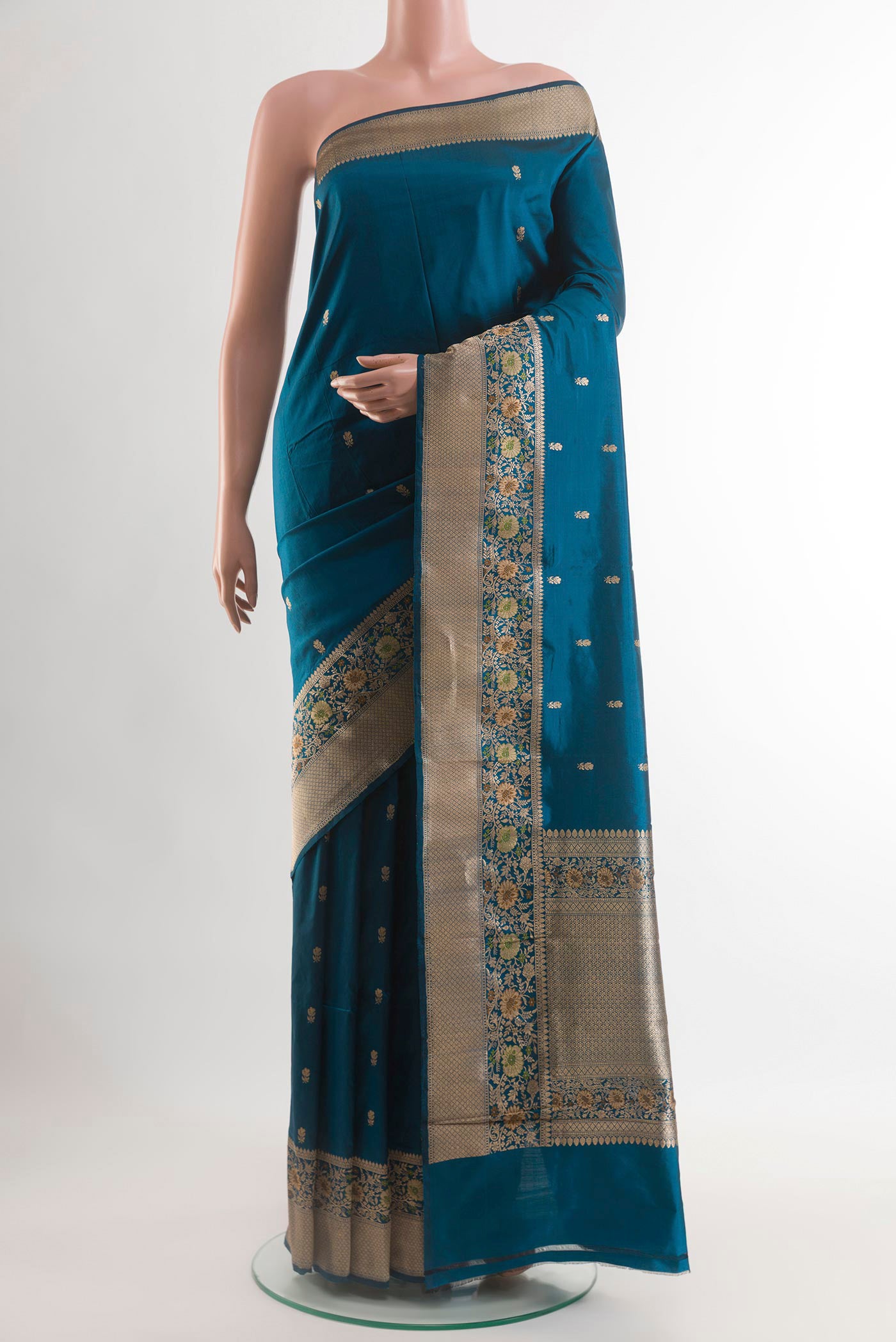 Blue Banarasi Silk Saree with Zari Butta on the body and Zari Border.  displayed on a mannequin