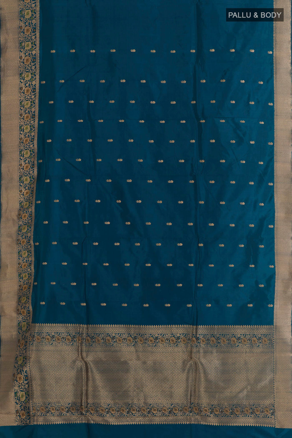 Flat view of Blue Banarasi Silk Saree with Zari Butta on the body and Zari Border. 