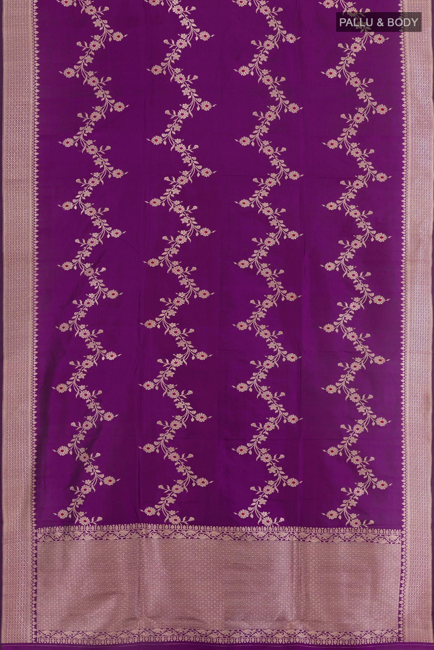 Flat view of Purple Banarasi Katan Silk Saree with Zari Butta on the body and Zari Border. 