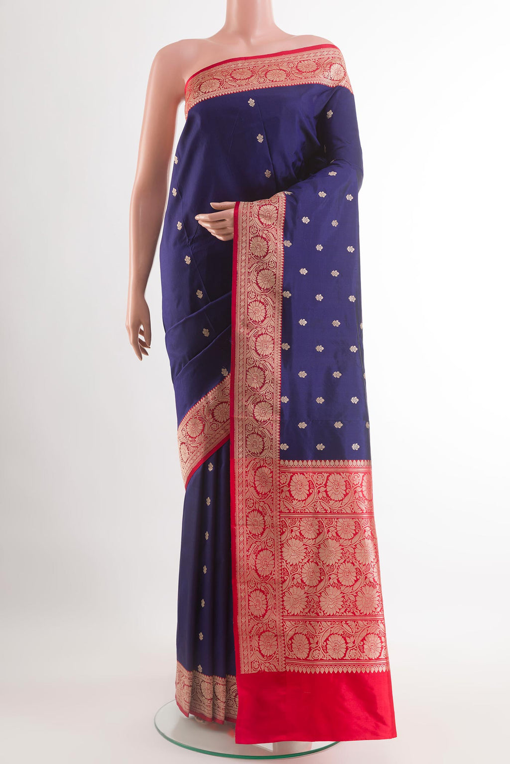 Blue Banarasi Katan Silk Saree with Zari Butta on the body and Zari Border.  displayed on a mannequin