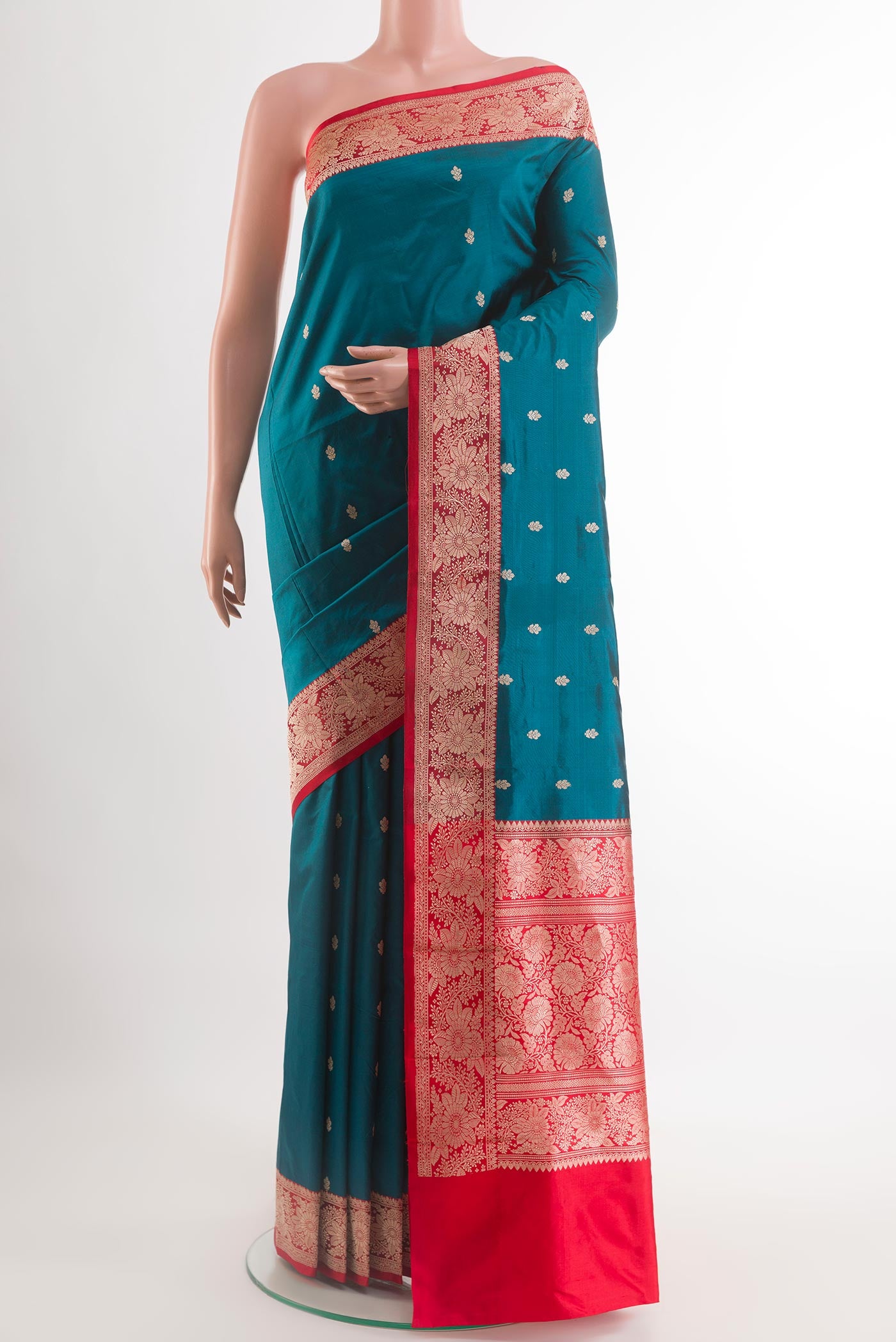 Blue Banarasi Katan Silk Saree with Zari Butta on the body and Zari Border.  displayed on a mannequin