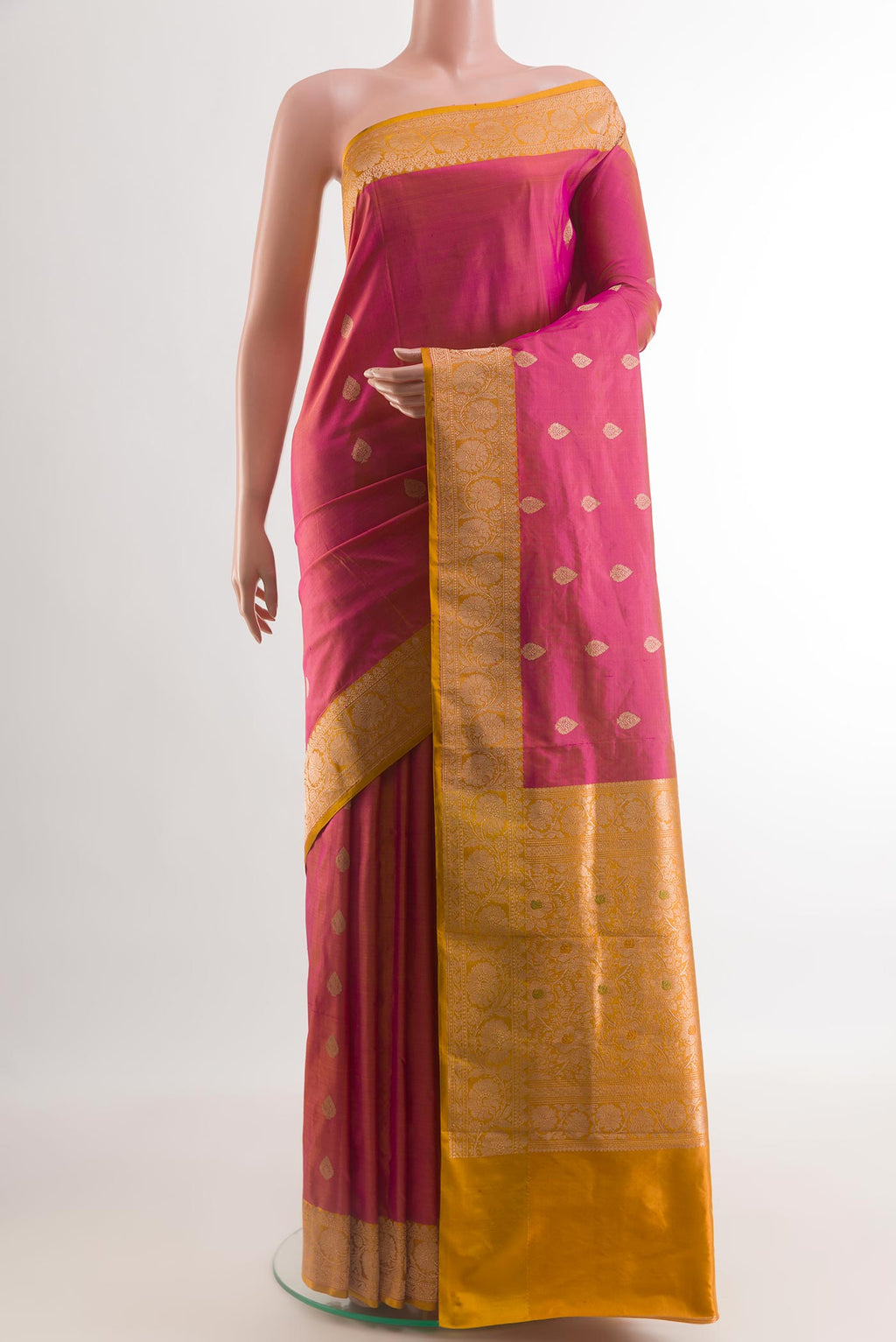Pink Banarasi Katan Silk Saree with Zari Butta on the body and Zari Border.  displayed on a mannequin