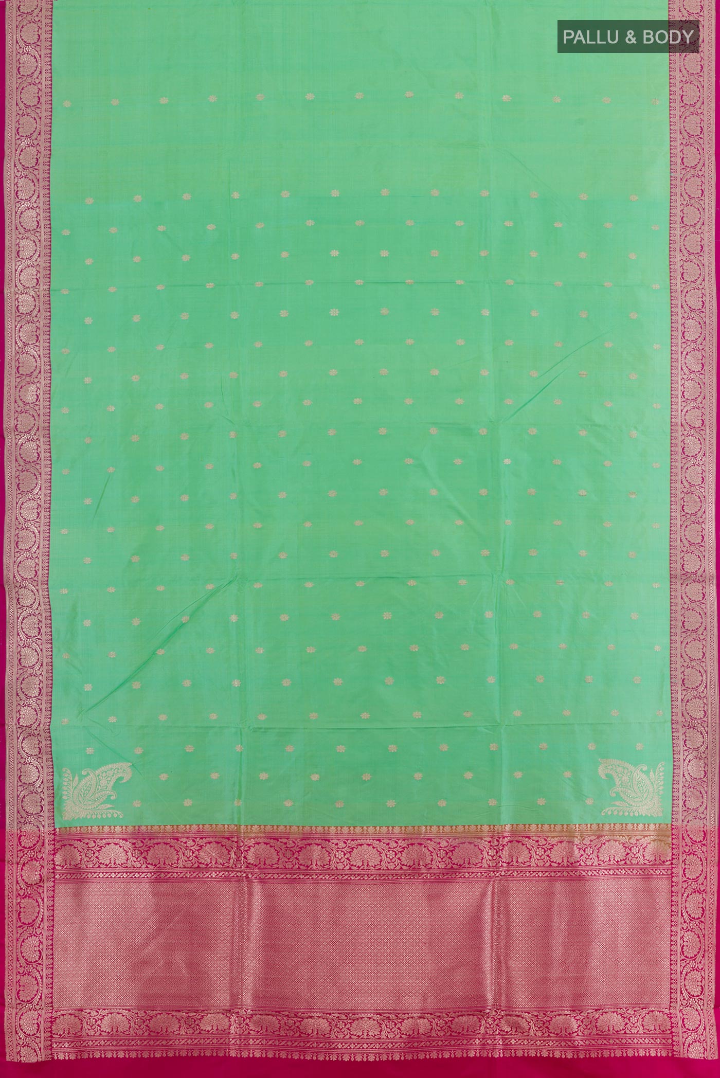 Flat view of Green Banarasi Katan Silk Saree with Zari Butta on the body and Zari Border. 