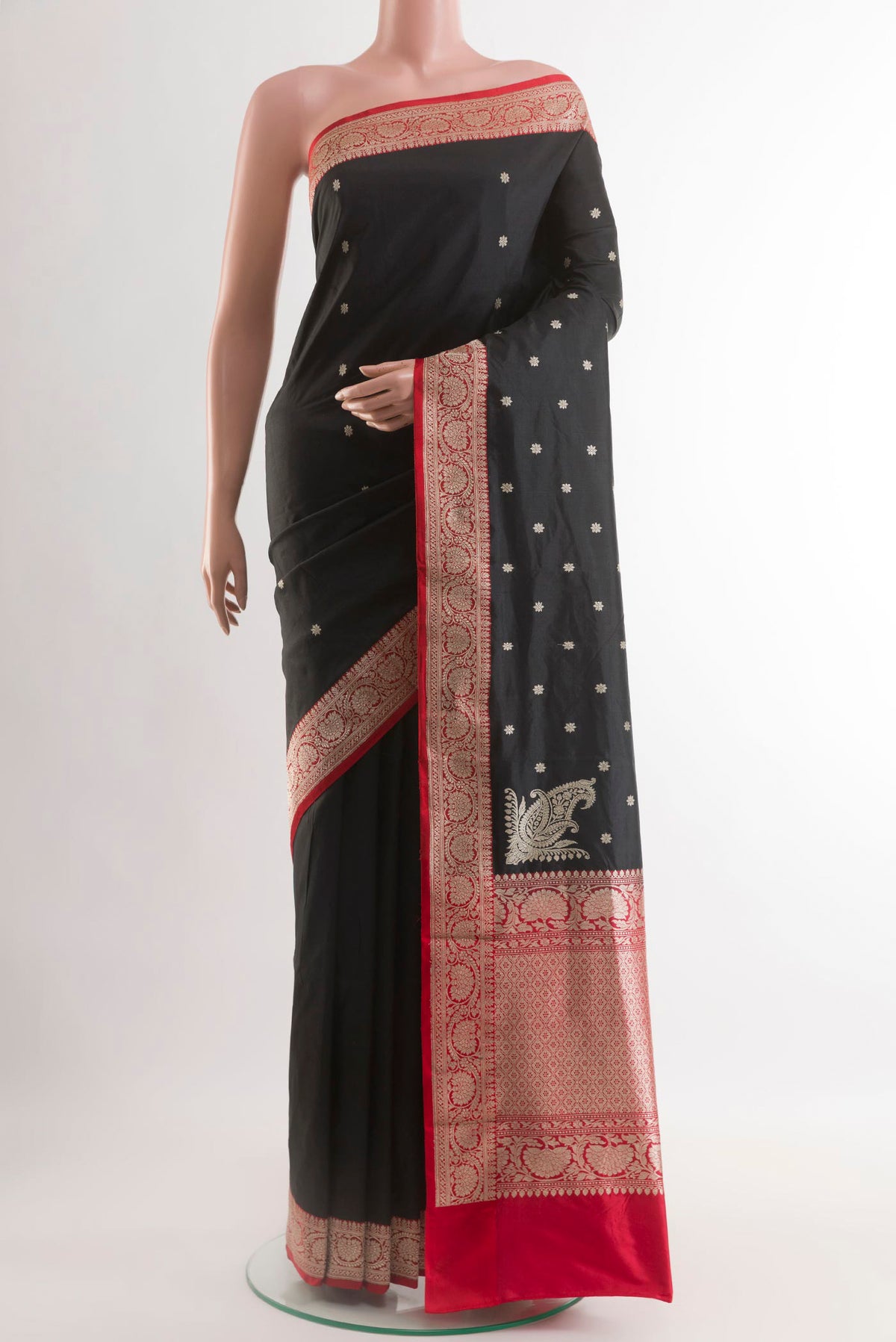 Black Banarasi Silk Saree with Zari Butta on the body and Zari Border.  displayed on a mannequin