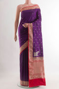 Purple Banarasi Silk Saree with Zari Butta on the body and Zari Border.  displayed on a mannequin