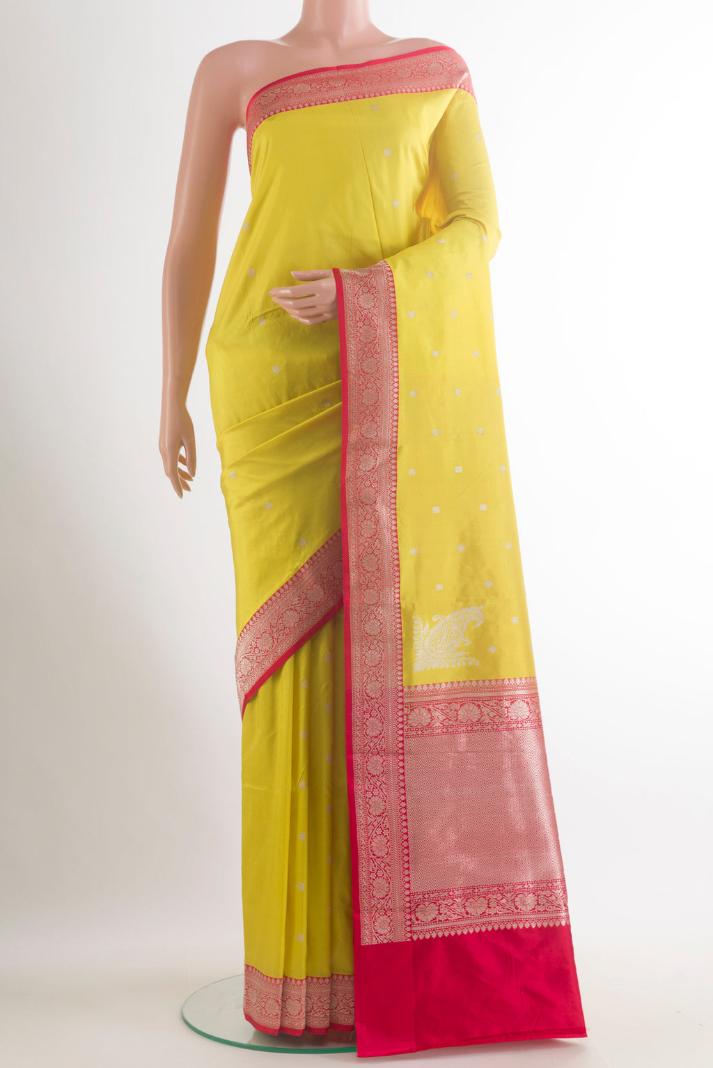 Pure Silk Yellow Banarasi Katan Saree with Zari Butta on the body and Zari Border.  displayed on a mannequin