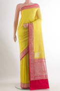 Pure Silk Yellow Banarasi Katan Saree with Zari Butta on the body and Zari Border.  displayed on a mannequin