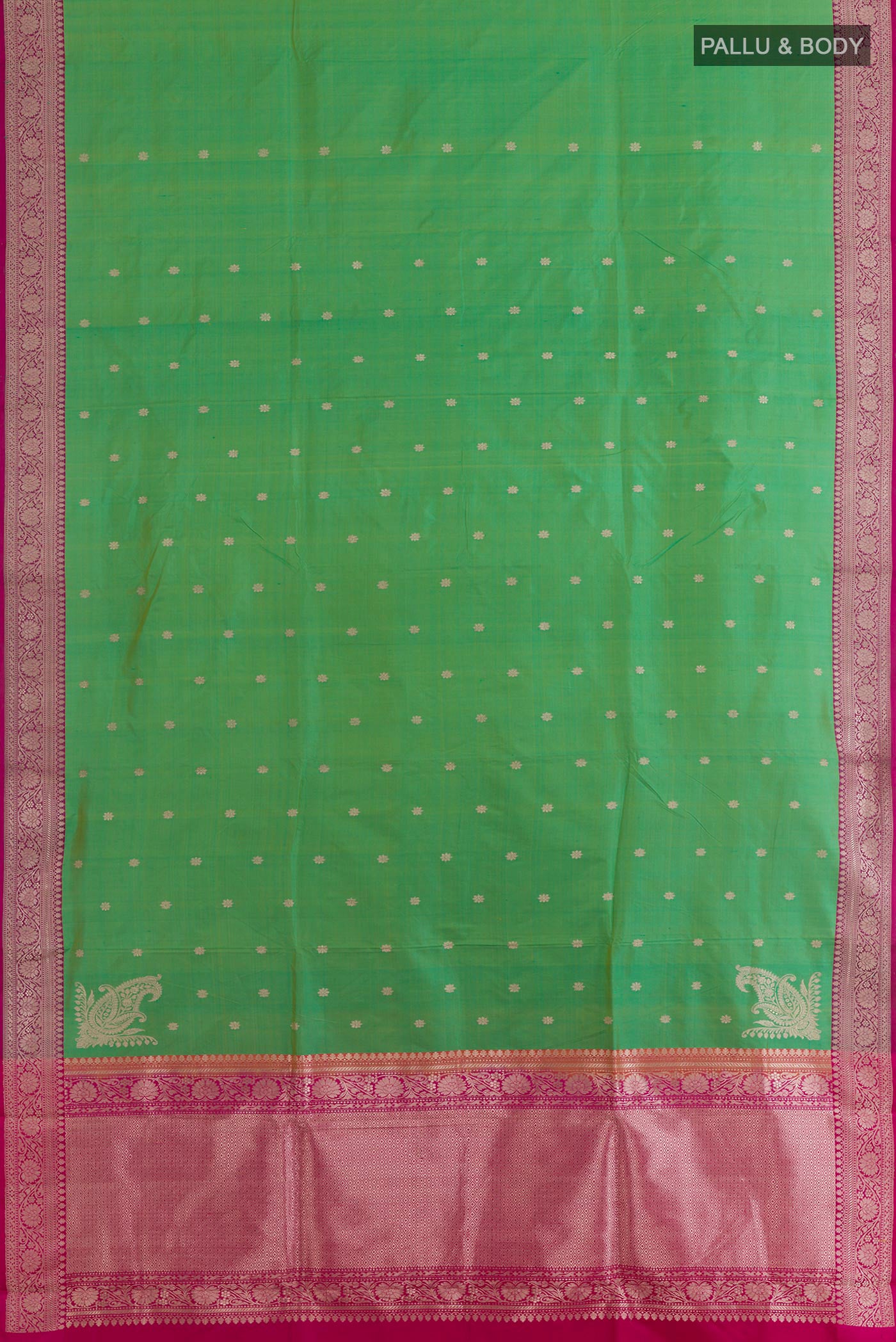 Flat view of Green Banarasi Silk Saree with Zari Butta on the body and Zari Border. 