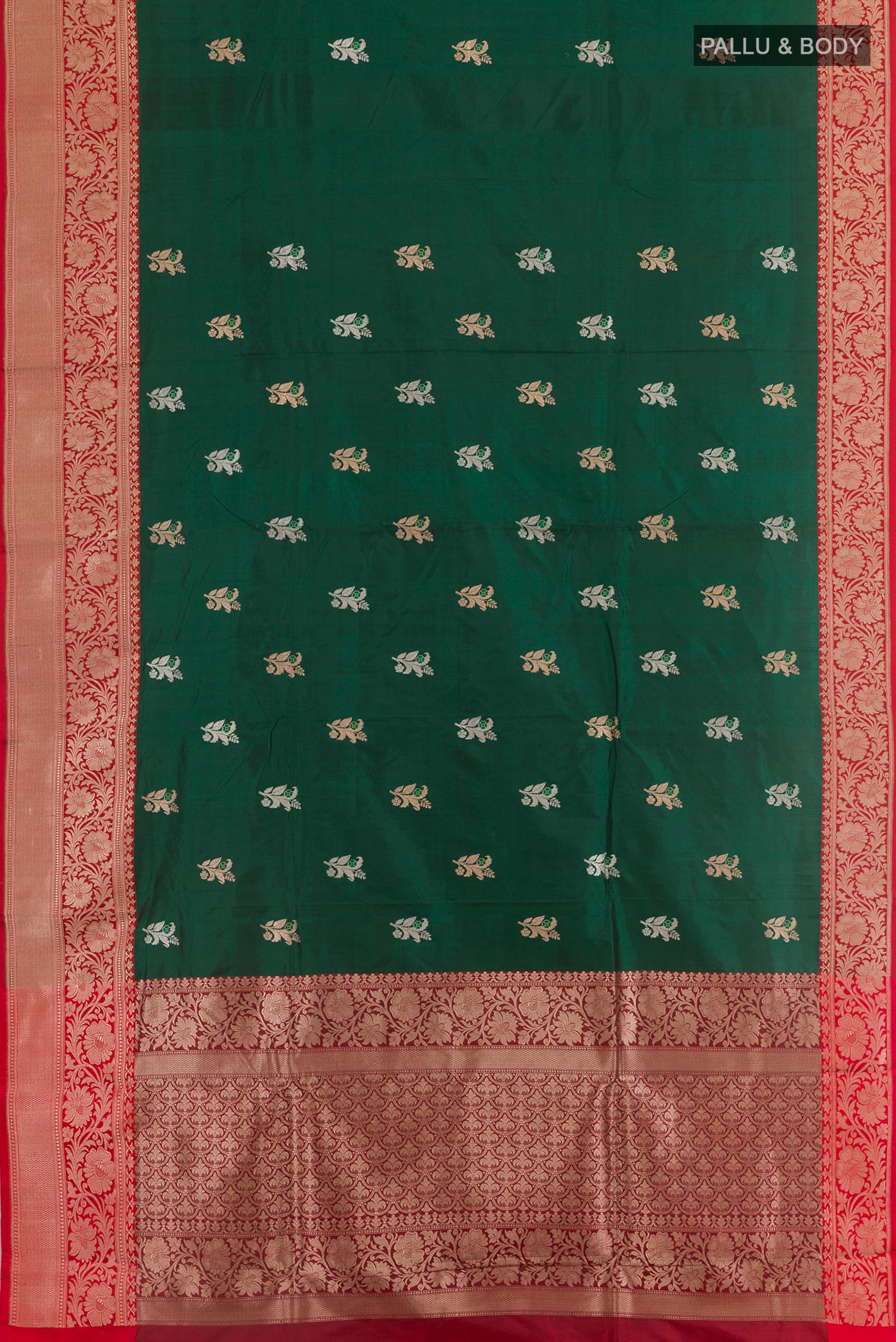 Flat view of Bottle Green Banarasi Katan Silk Saree with Zari Butta on the body and Zari Border. 