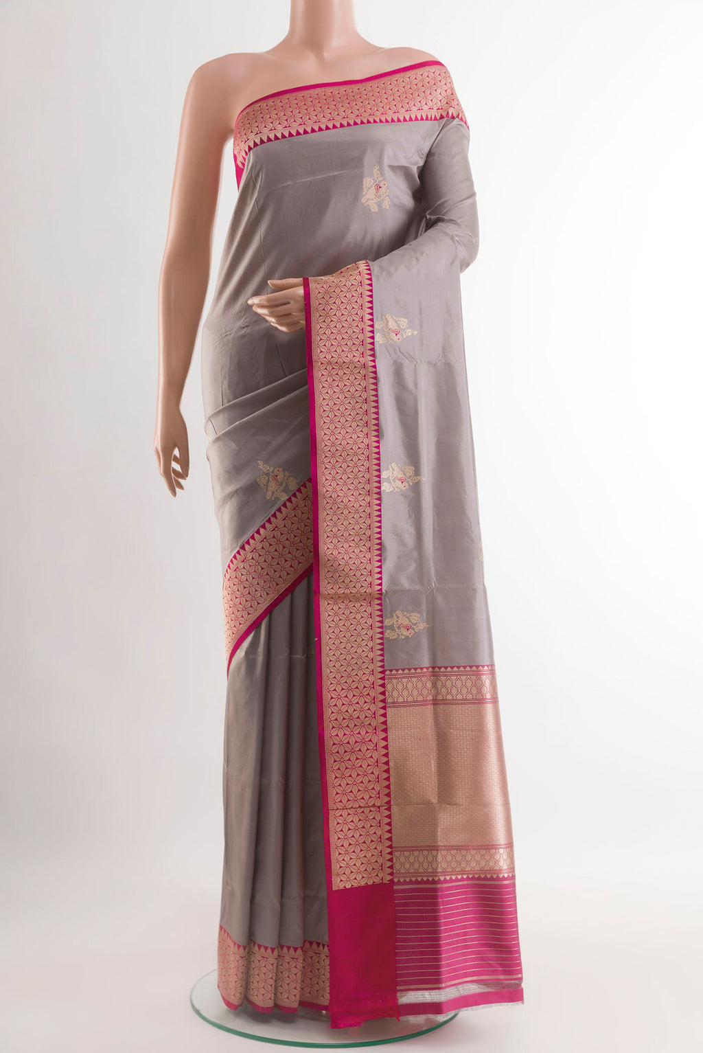 Grey Banarasi Silk Saree with Zari Butta on the body and Zari Border.  displayed on a mannequin