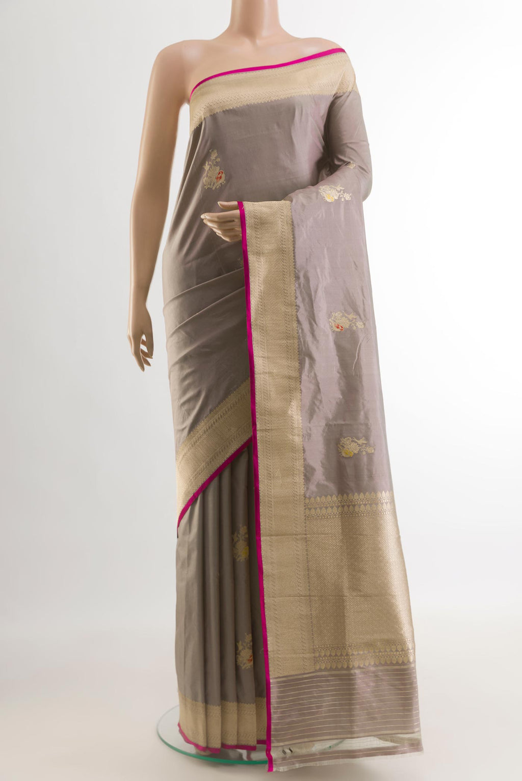 Grey Banarasi Katan Silk Saree with Zari Butta on the body and Zari Border.  displayed on a mannequin