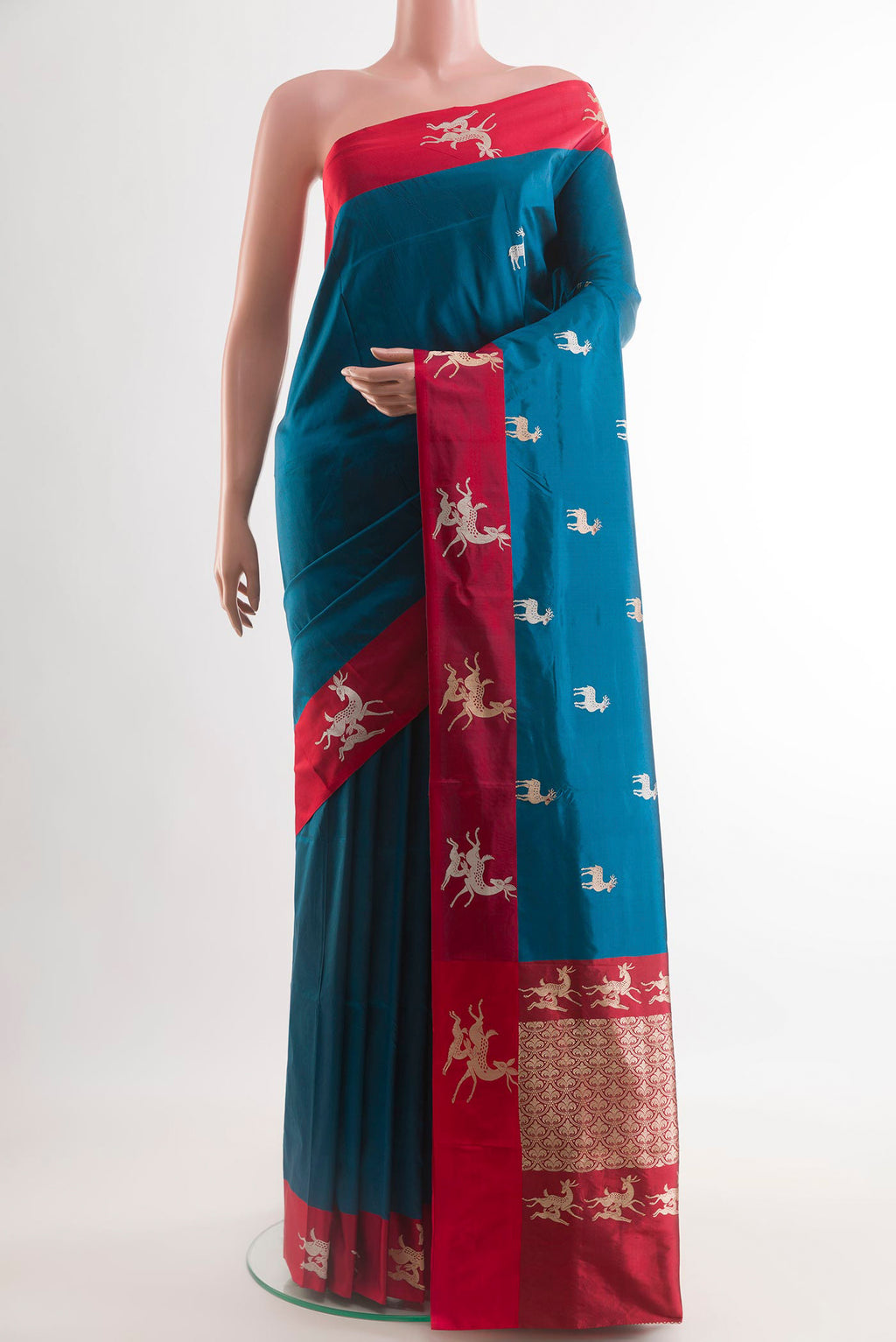 Blue Banarasi Katan Silk Saree with Zari Butta on the body and Zari Border.  displayed on a mannequin