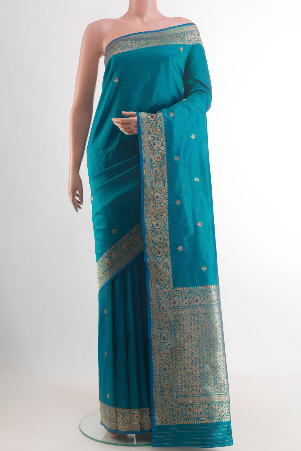 Peacock Blue Banarasi Katan Silk Saree with Zari Butta on the body and Zari Border.  displayed on a mannequin