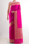 Rani Pink Banarasi Katan Silk Saree with Zari Butta on the body and Zari Border.  displayed on a mannequin