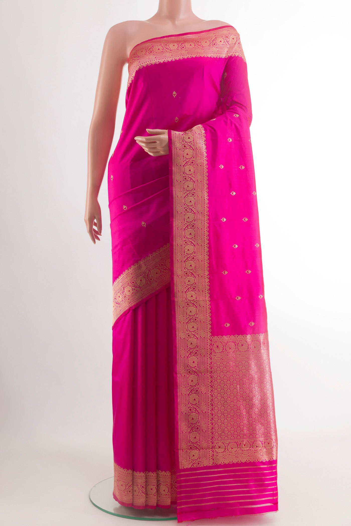 Rani Pink Banarasi Katan Silk Saree with Zari Butta on the body and Zari Border.  displayed on a mannequin