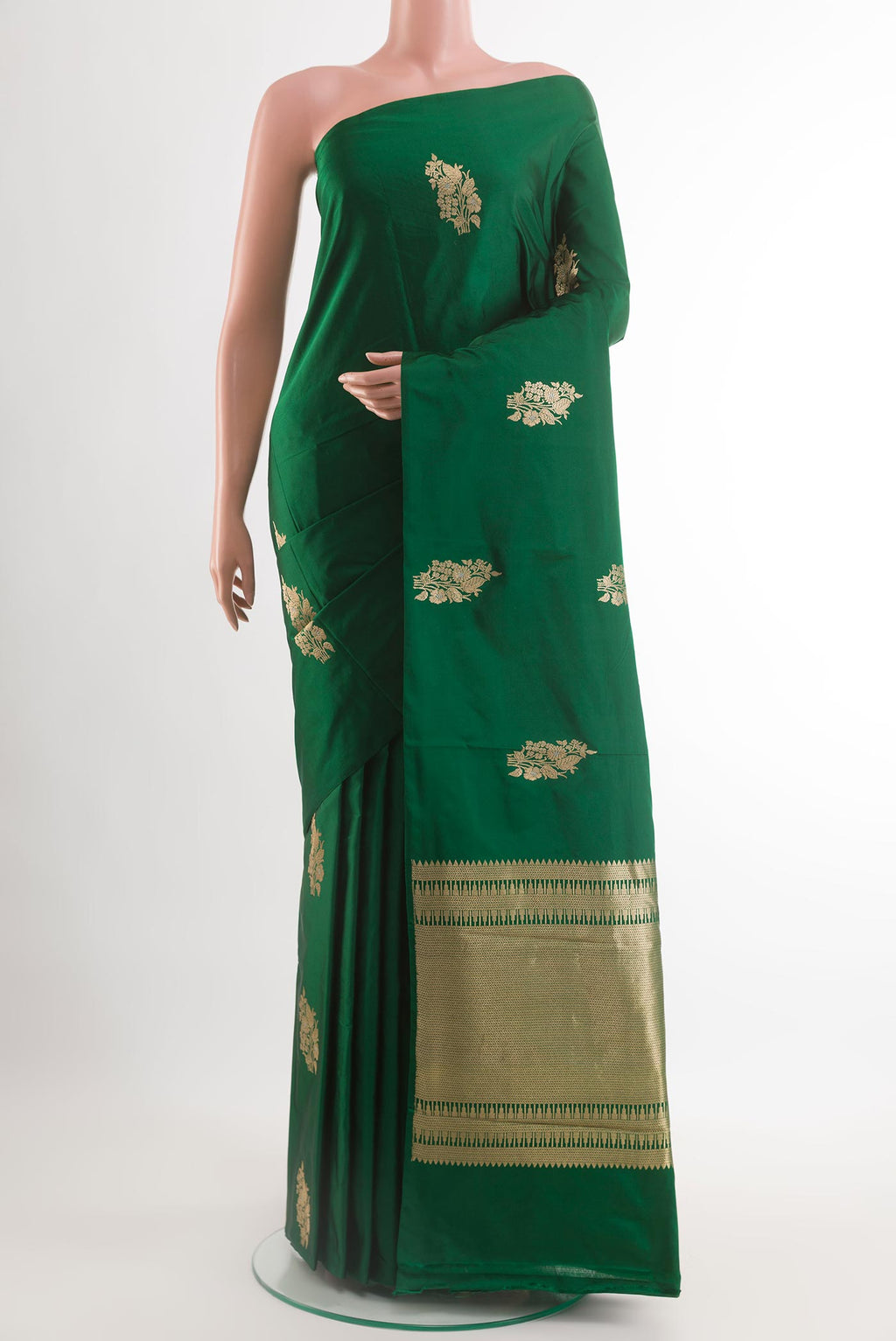 Green Banarasi Silk Saree with Zari Butta on the body and Zari Border.  displayed on a mannequin