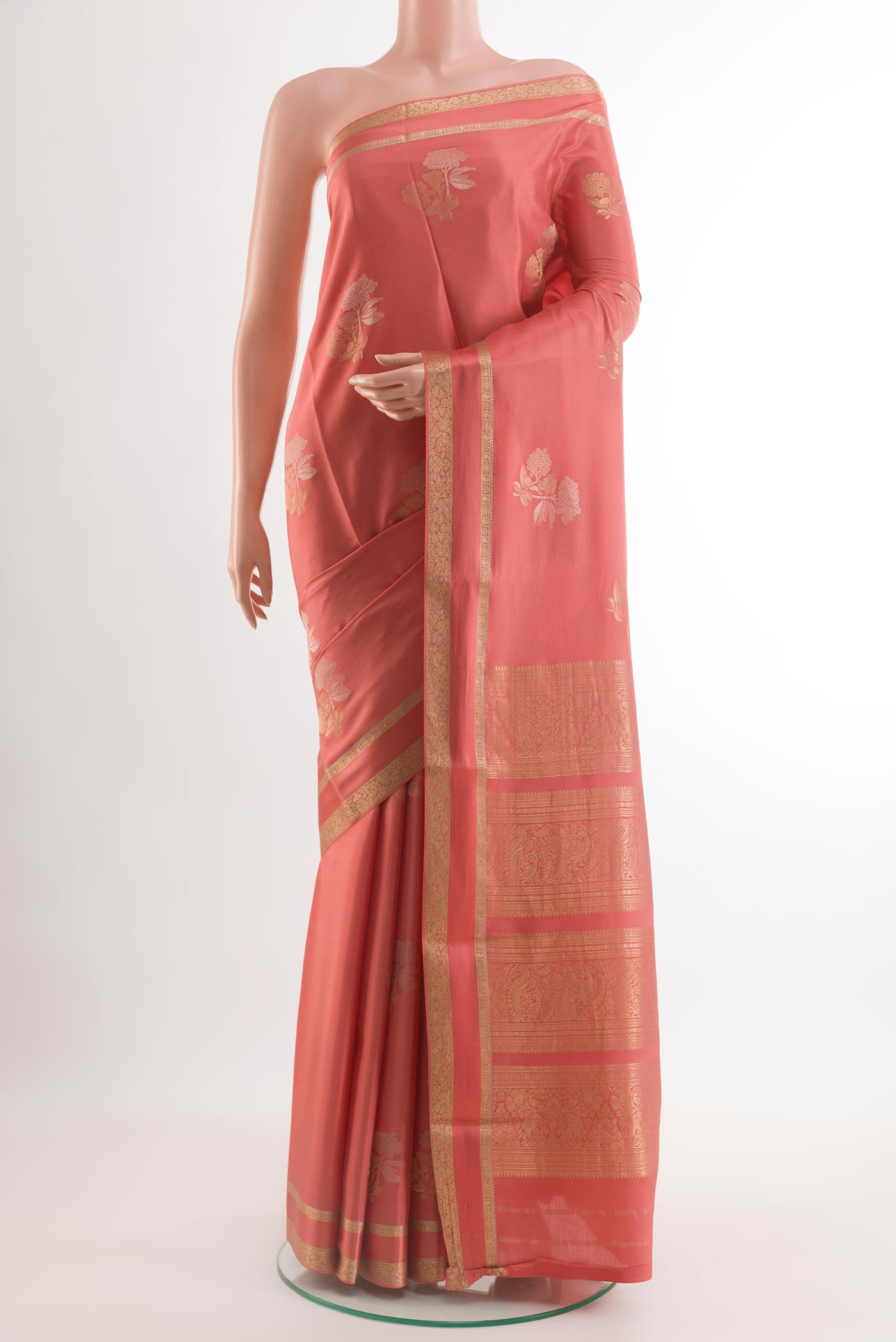 Coral Mysore Crepe Saree with Zari Butta on the body and Zari Border.  displayed on a mannequin