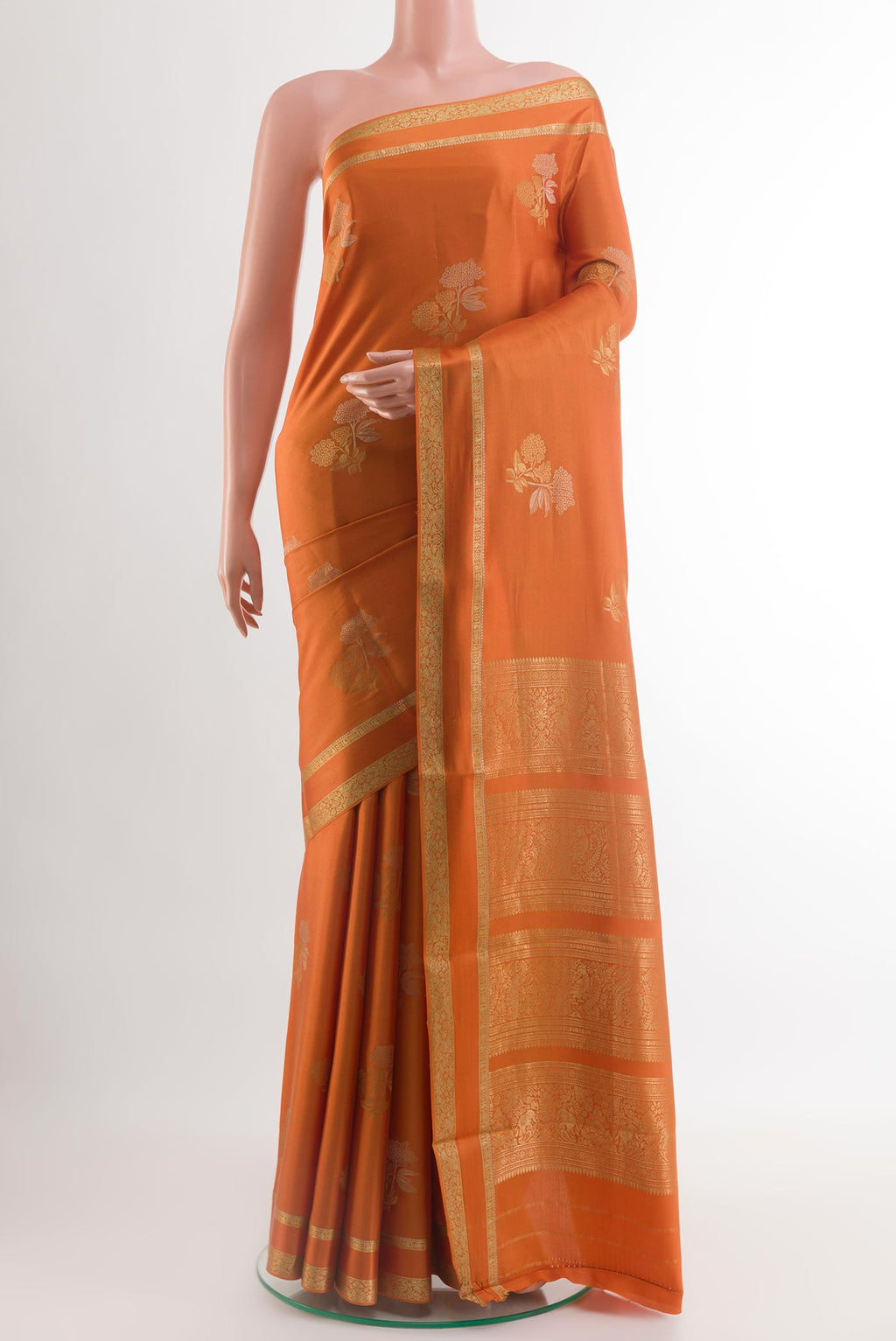 Orange Mysore Crepe Saree with Zari Butta on the body and Zari Border.  displayed on a mannequin
