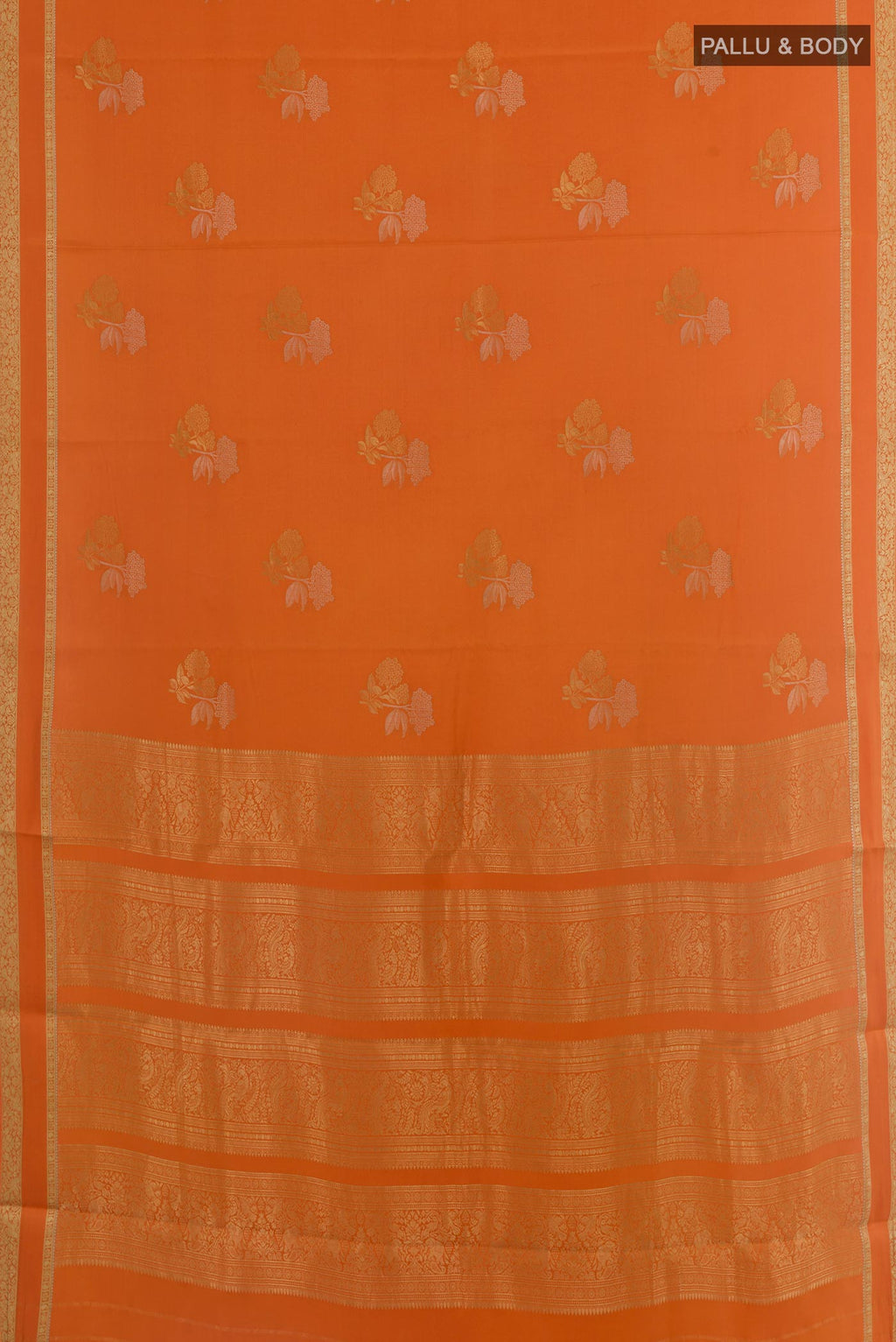 Flat view of Orange Mysore Crepe Saree with Zari Butta on the body and Zari Border. 