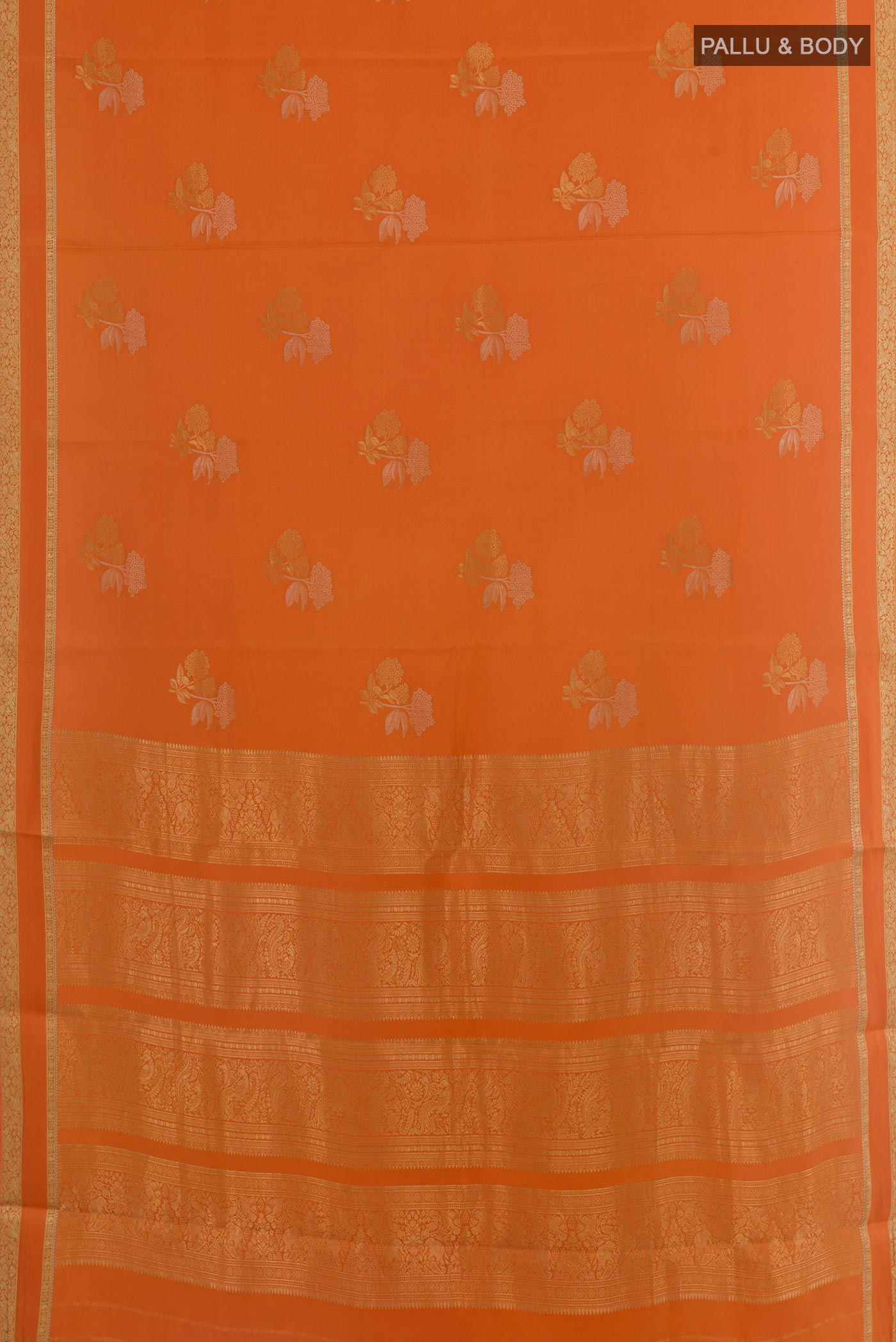 Flat view of Orange Mysore Crepe Saree with Zari Butta on the body and Zari Border. 