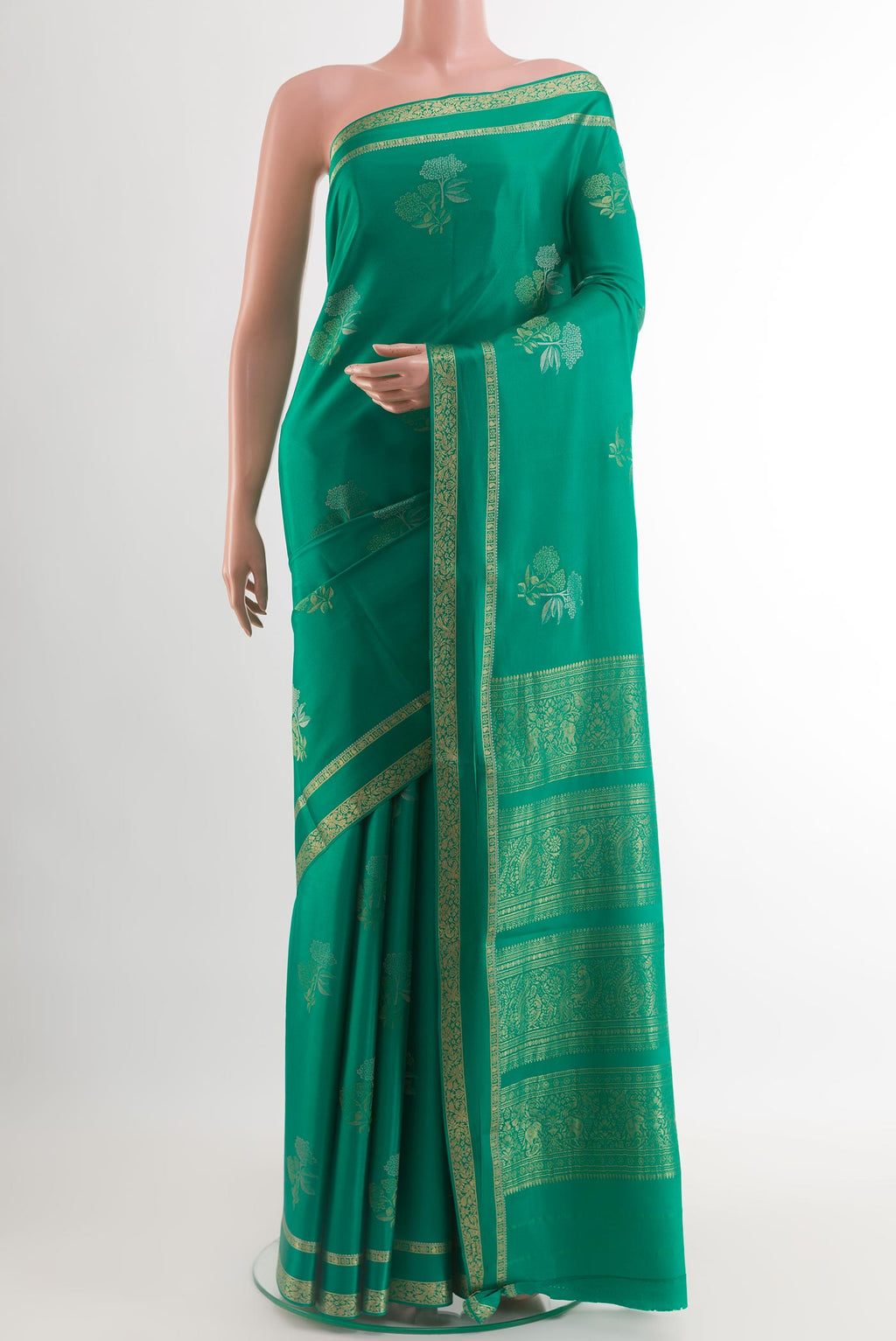 Sea Green Mysore Crepe Saree with Zari Butta on the body and Zari Border.  displayed on a mannequin