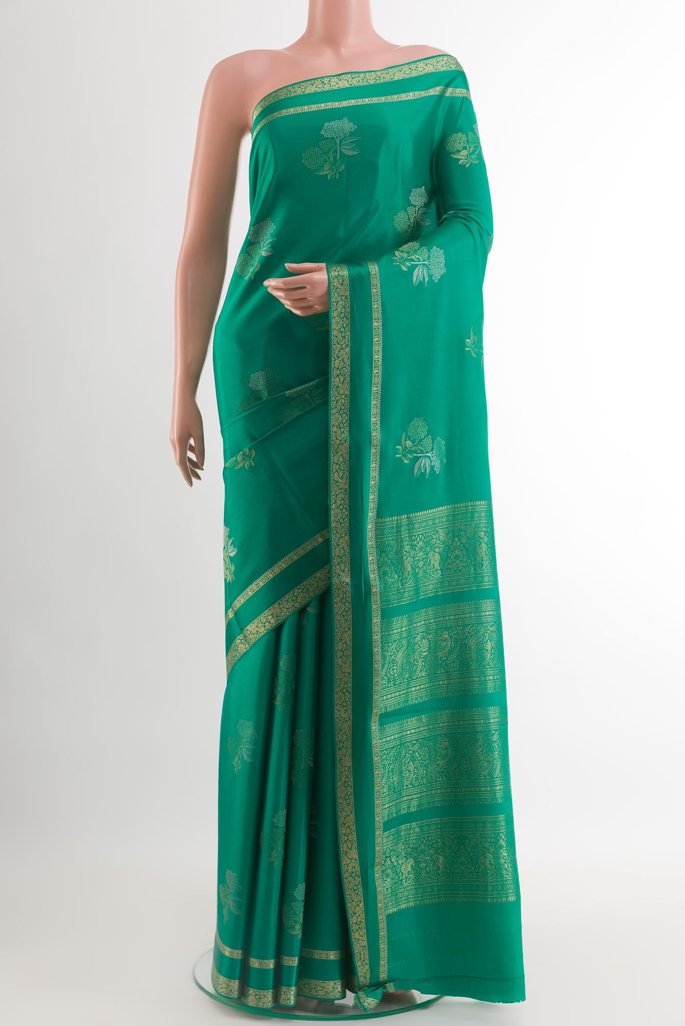 Sea Green Mysore Crepe Saree with Zari Butta on the body and Zari Border.  displayed on a mannequin