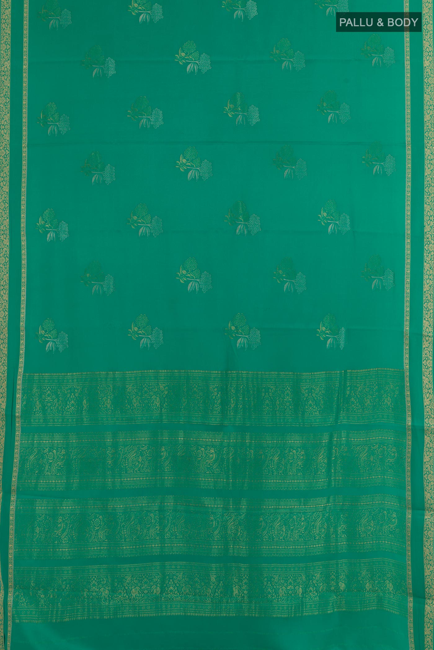 Flat view of Sea Green Mysore Crepe Saree with Zari Butta on the body and Zari Border. 