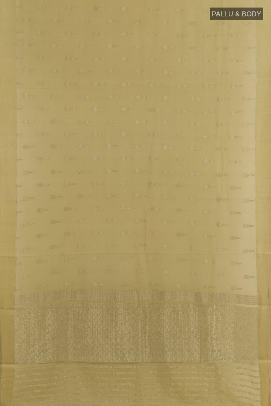 Flat view of Beige Mysore Crepe Saree with Zari Butta on the body and Zari Border. 