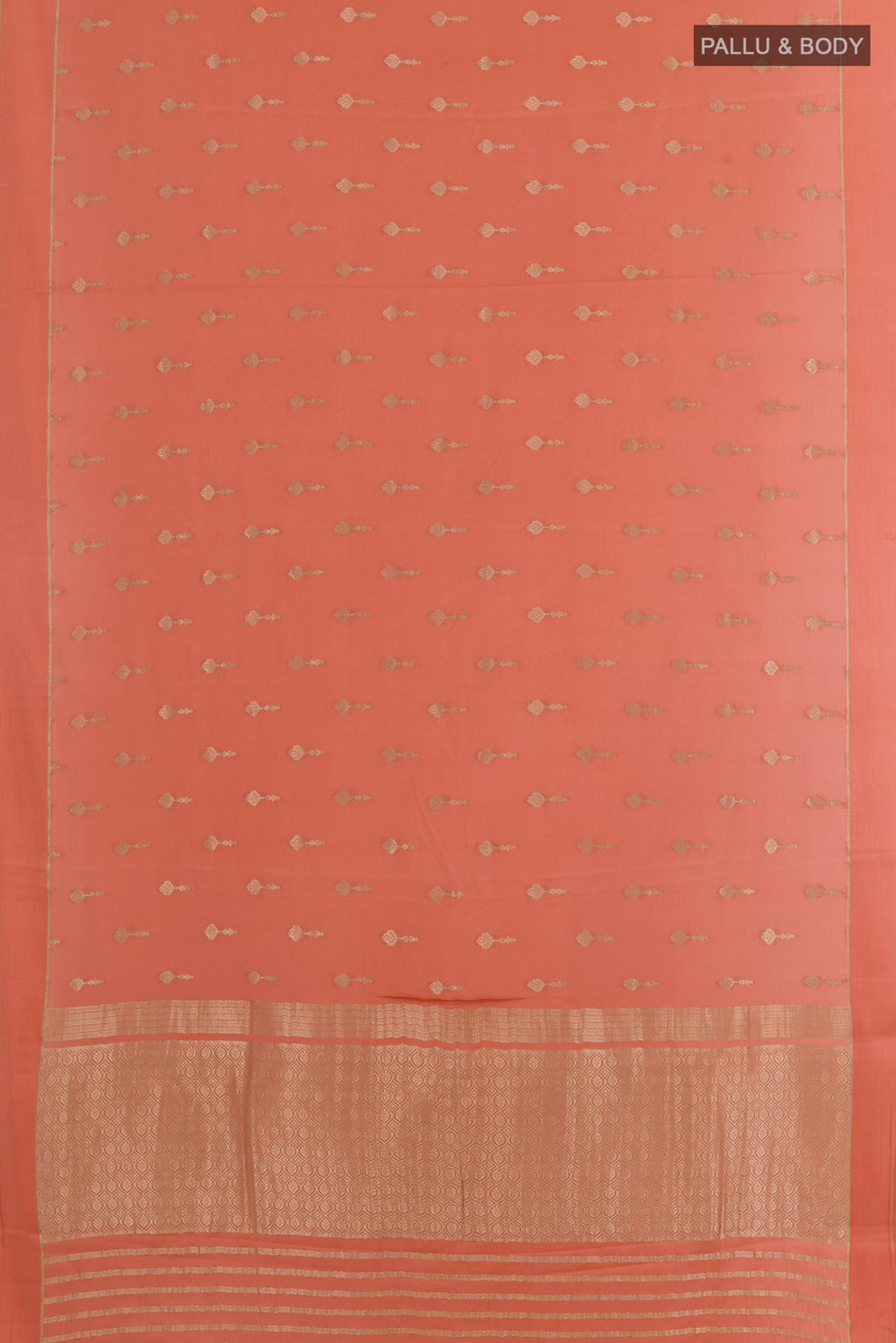 Flat view of Peach Mysore Crepe Saree with Zari Butta on the body and Zari Border. 