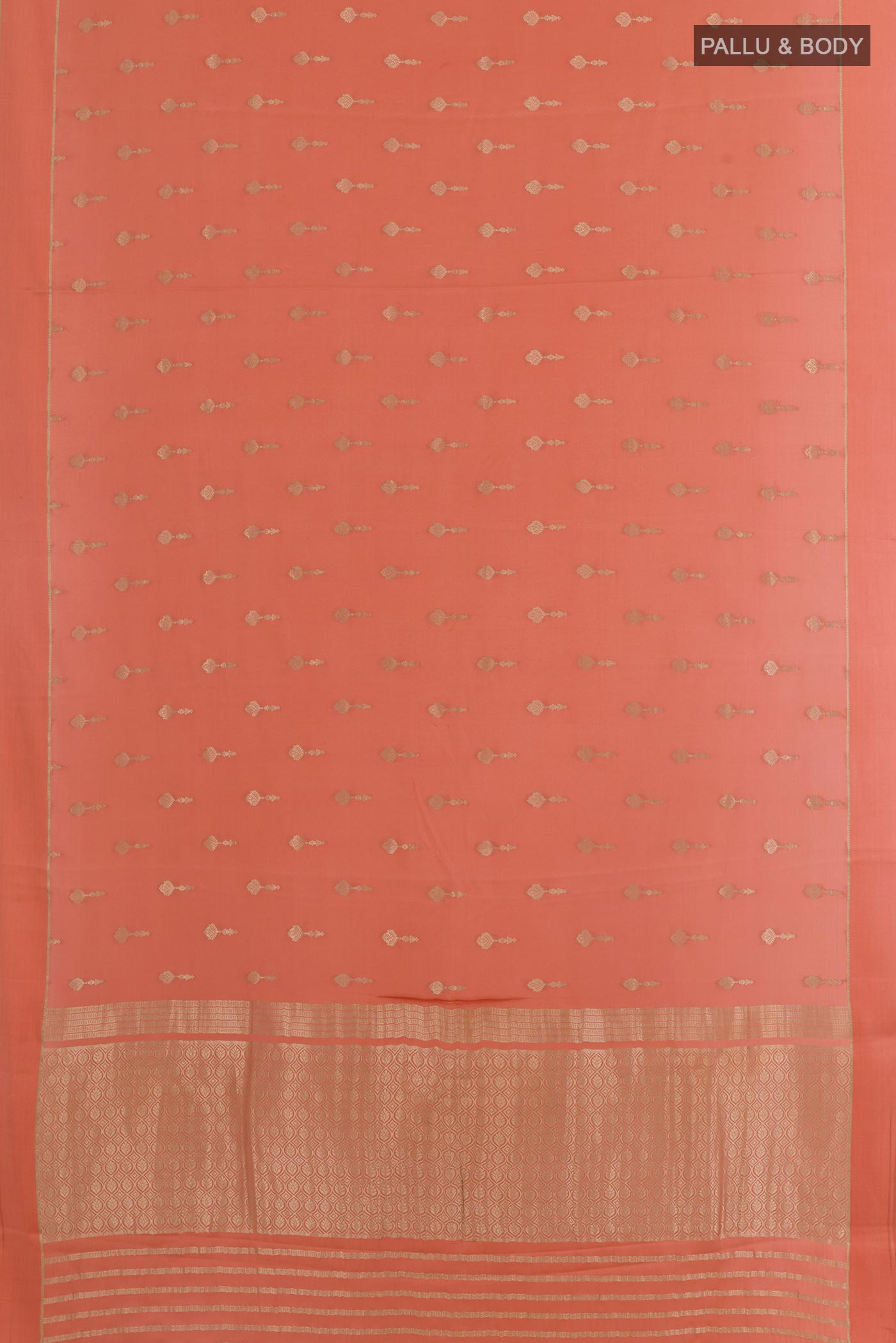 Flat view of Peach Mysore Crepe Saree with Zari Butta on the body and Zari Border. 