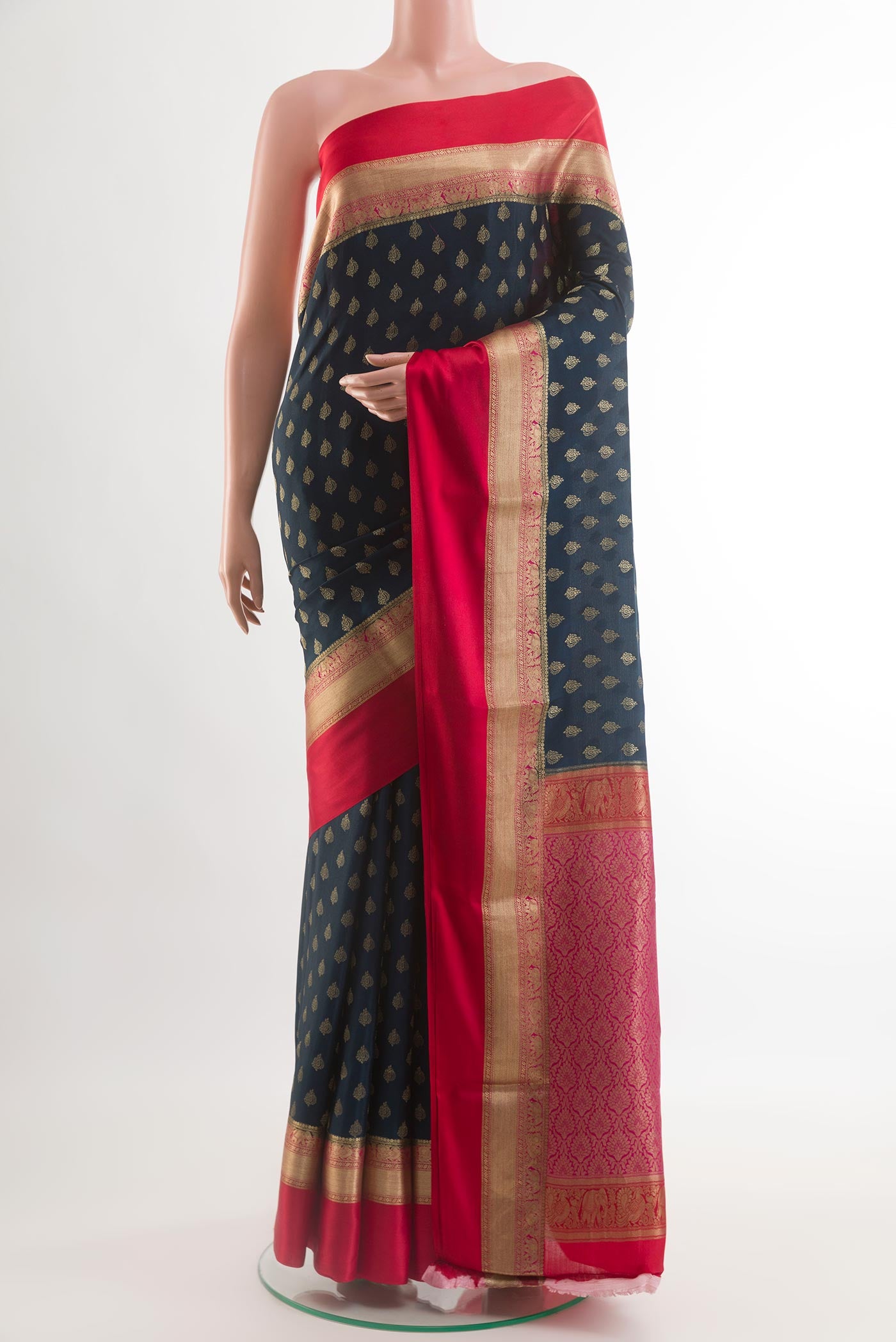 Blue Mysore Crepe Saree with Zari Butta on the body and Zari Border.  displayed on a mannequin