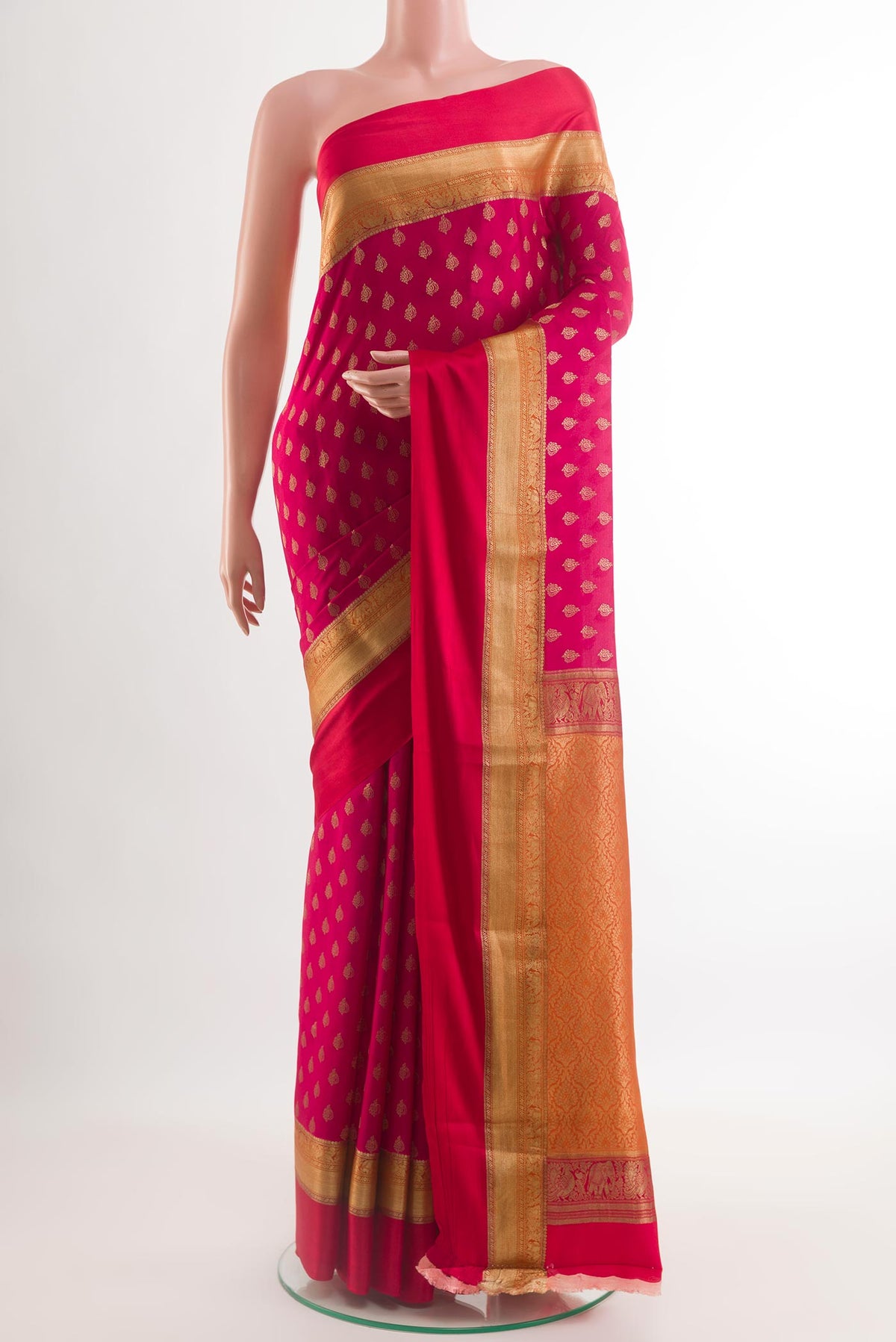 Dark Pink Mysore Crepe Saree with Zari Butta on the body and Zari Border.  displayed on a mannequin