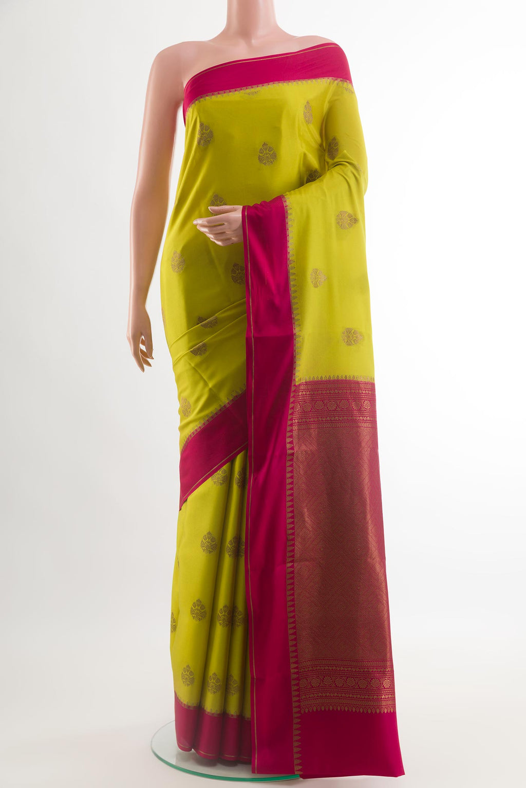 Yellow Mysore Crepe Saree with Zari Butta on the body and Zari Border.  displayed on a mannequin