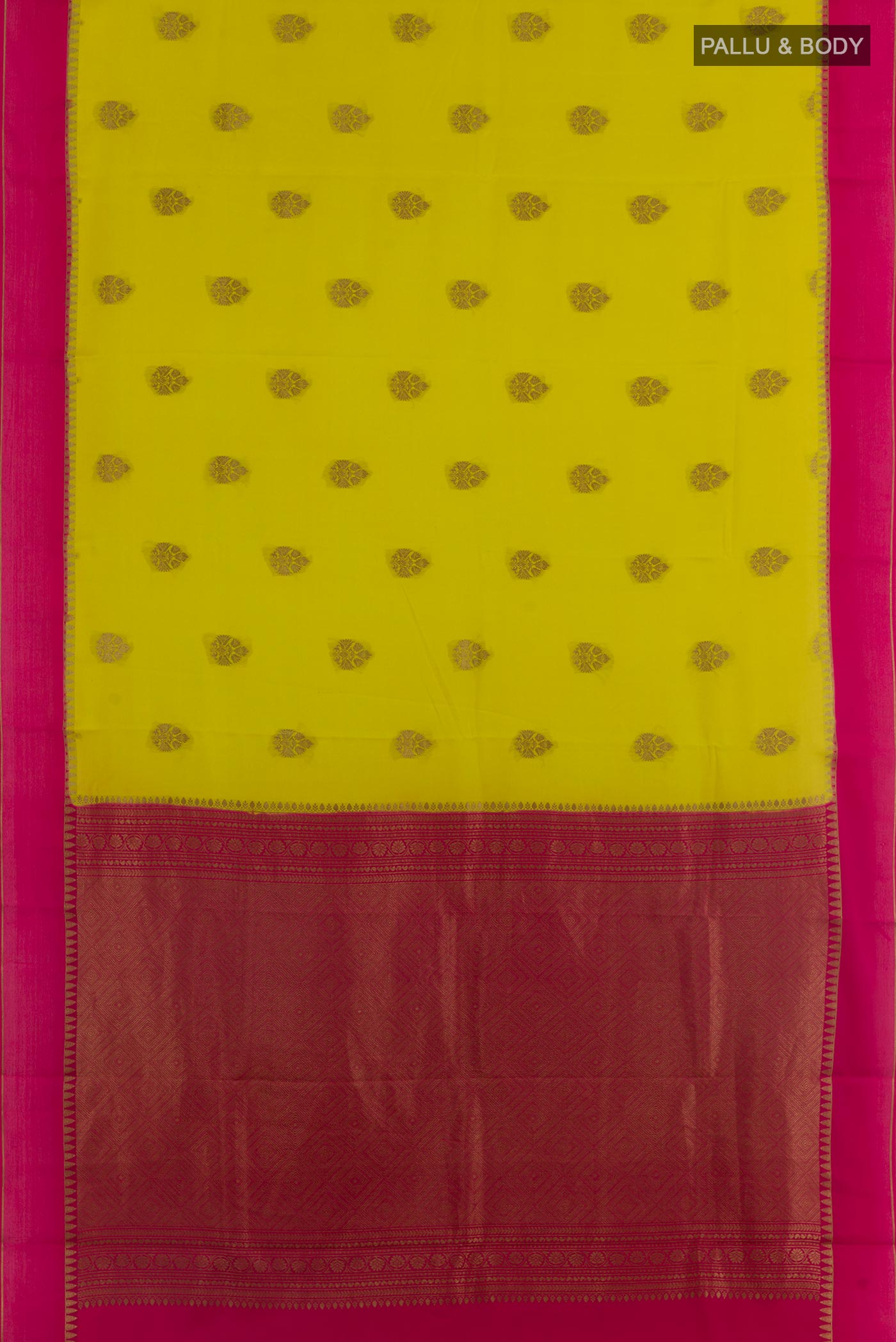 Flat view of Yellow Mysore Crepe Saree with Zari Butta on the body and Zari Border. 