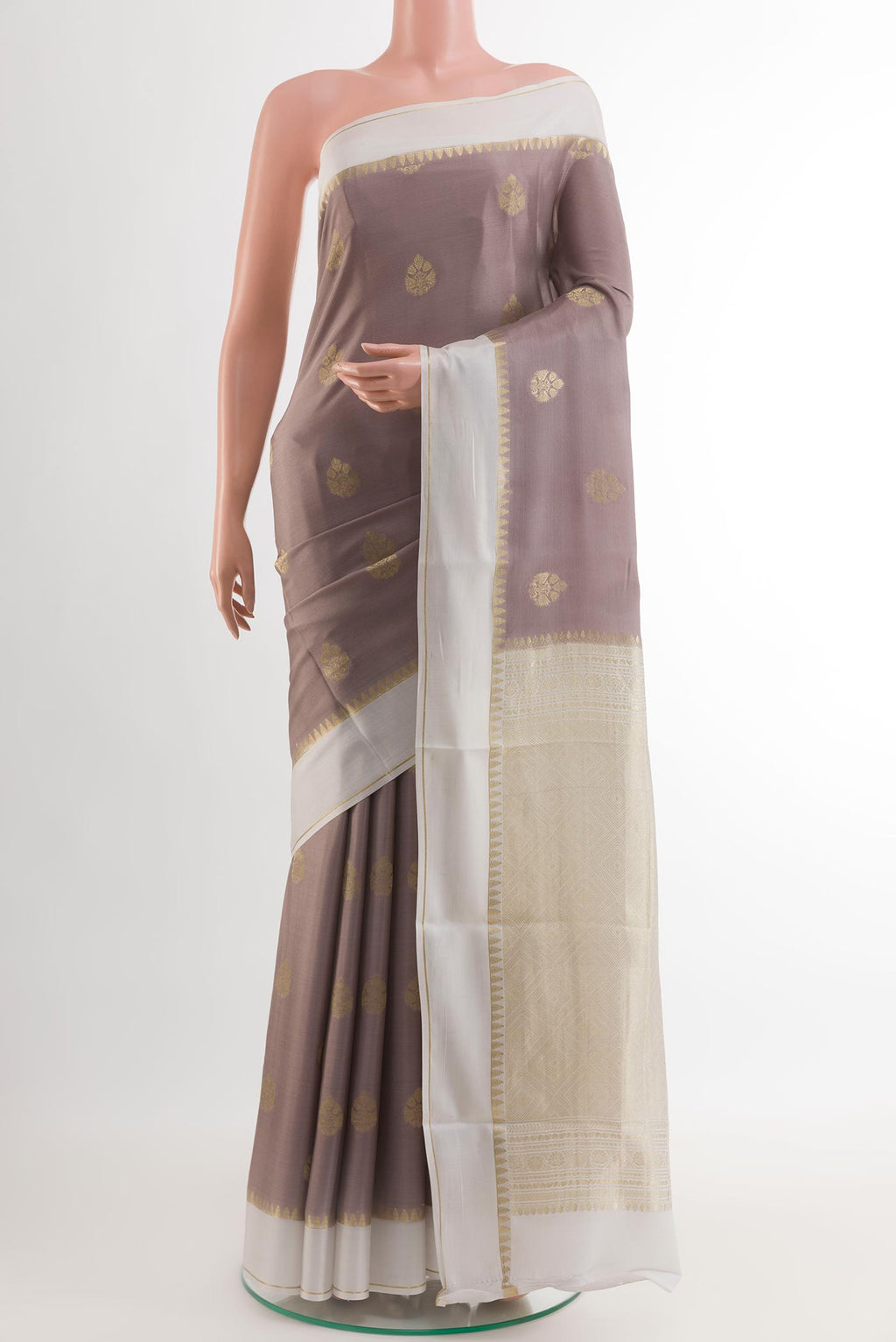 Brown Mysore Crepe Saree with Zari Butta on the body and Zari Border.  displayed on a mannequin