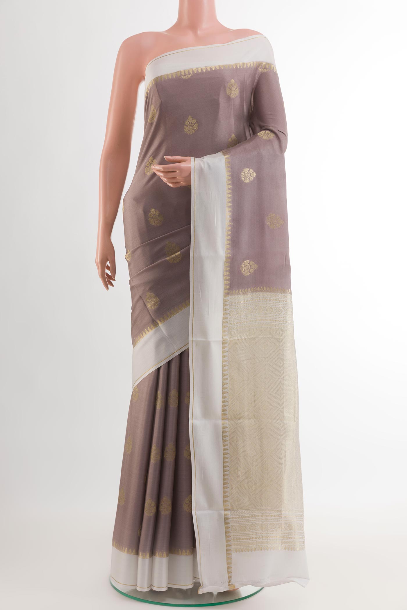 Brown Mysore Crepe Saree with Zari Butta on the body and Zari Border.  displayed on a mannequin