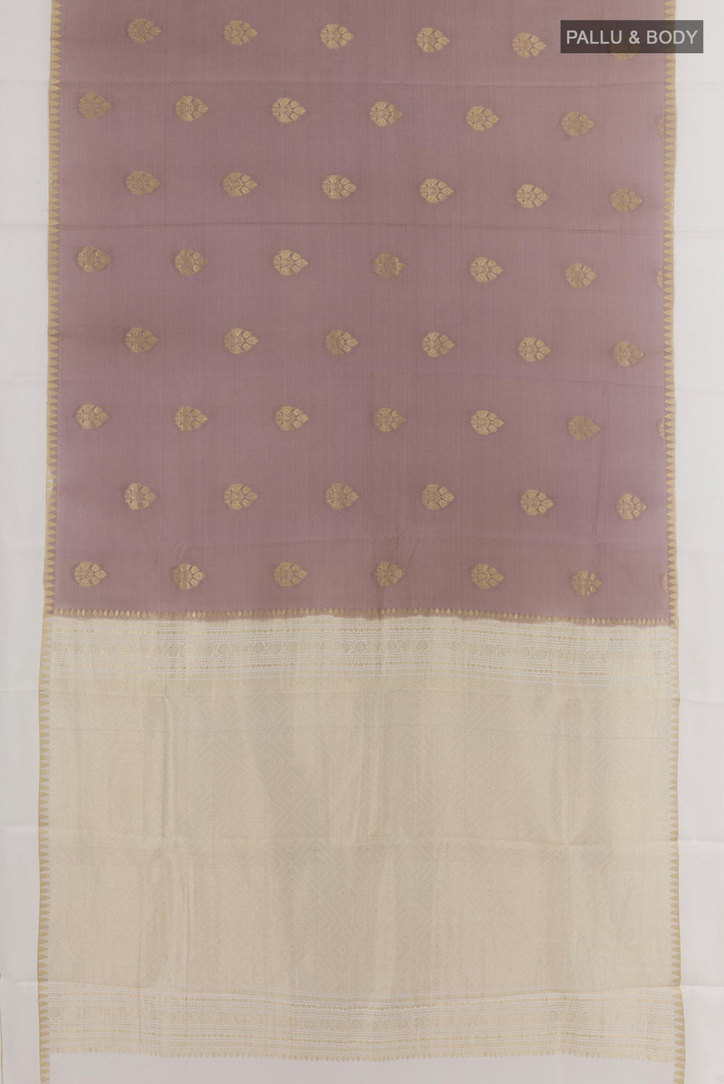 Flat view of Brown Mysore Crepe Saree with Zari Butta on the body and Zari Border. 