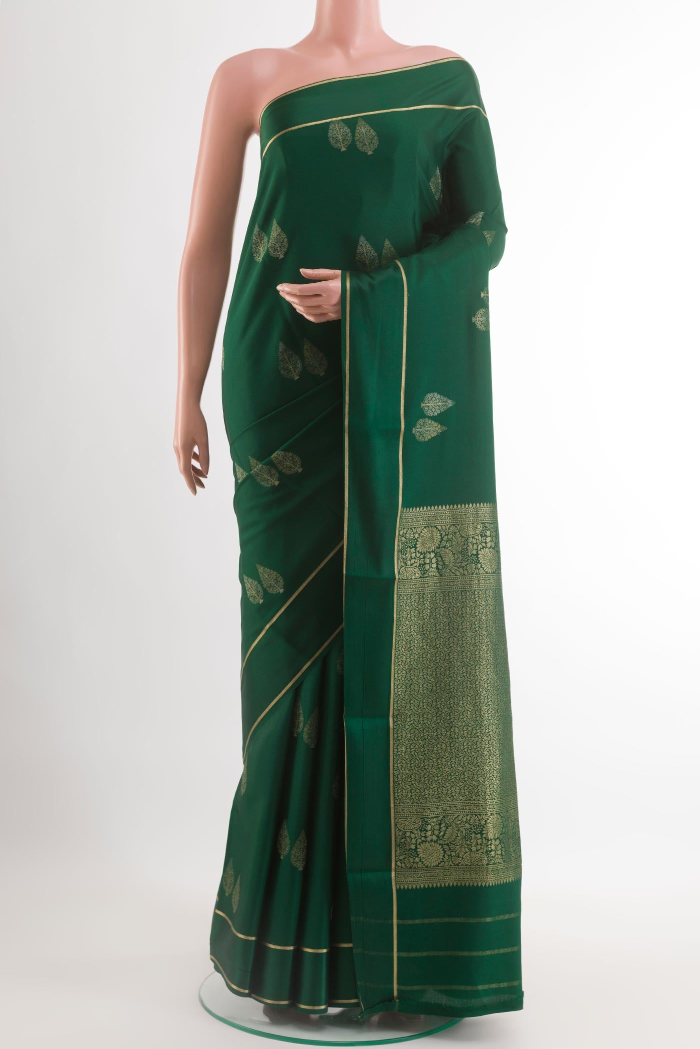 Green Mysore Silk Saree with Zari Butta on the body and Zari Border.  displayed on a mannequin