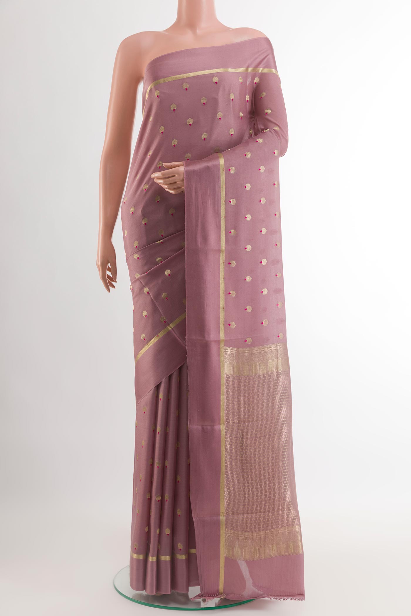 Lavender Mysore Crepe Saree with Zari Butta on the body and Zari Border.  displayed on a mannequin