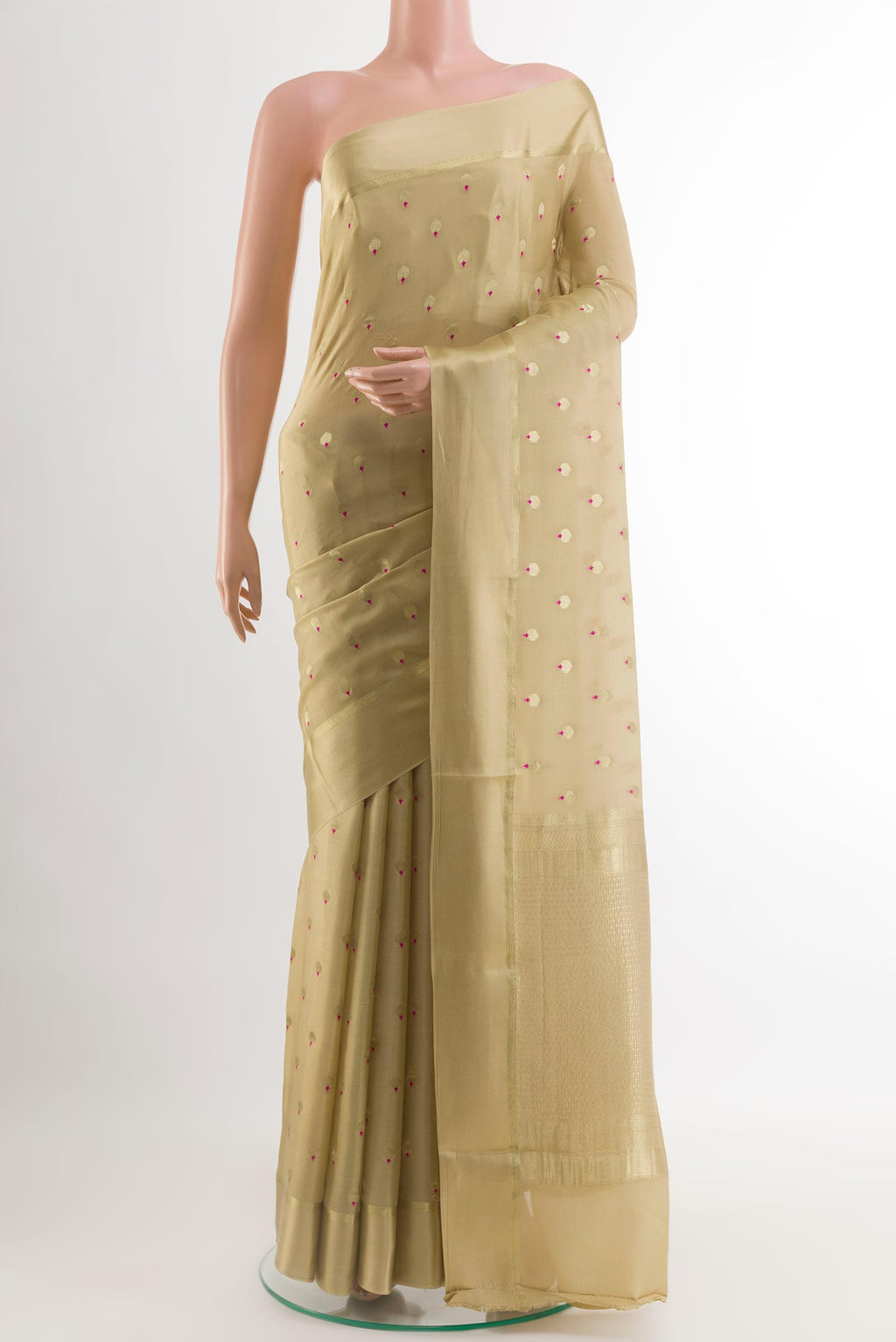 Beige Mysore Crepe Saree with Zari Butta on the body and Zari Border.  displayed on a mannequin