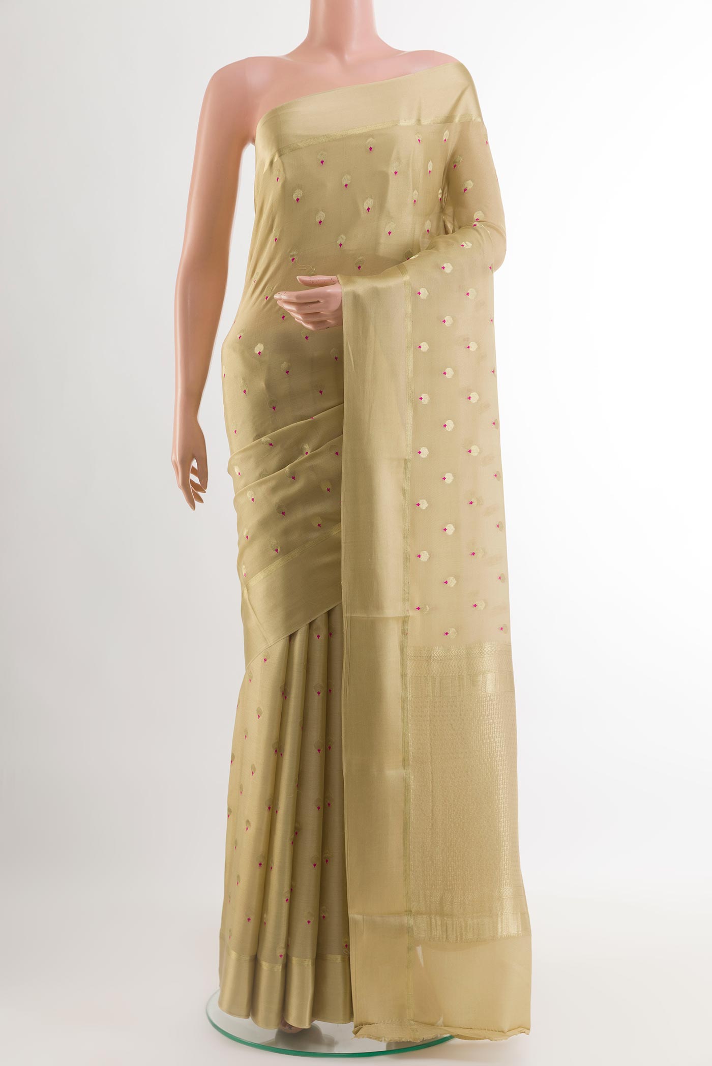 Beige Mysore Crepe Saree with Zari Butta on the body and Zari Border.  displayed on a mannequin