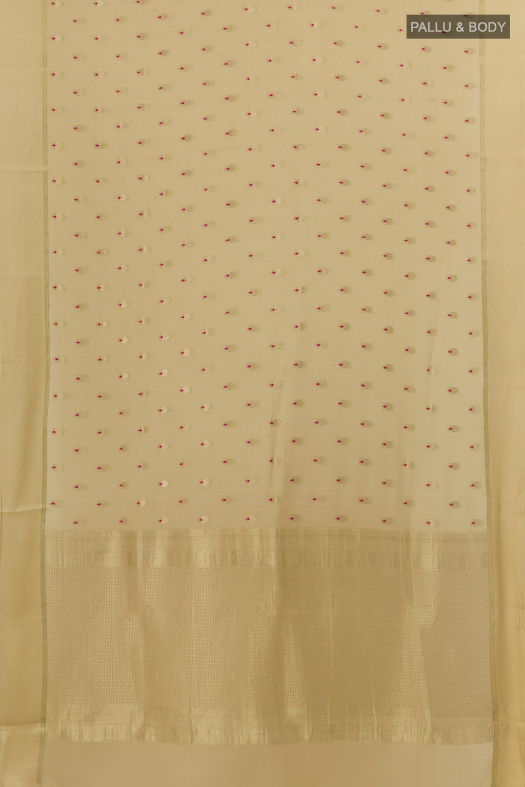 Flat view of Beige Mysore Crepe Saree with Zari Butta on the body and Zari Border. 