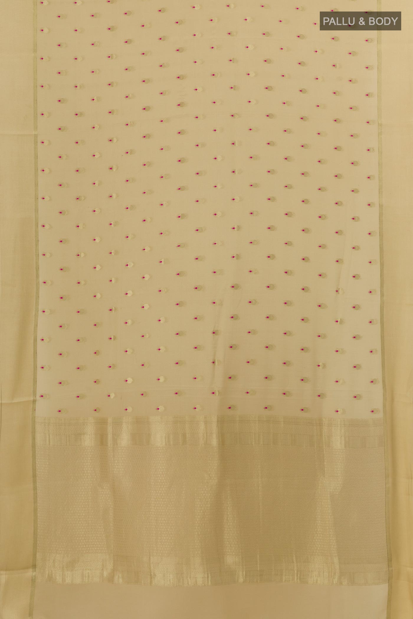 Flat view of Beige Mysore Crepe Saree with Zari Butta on the body and Zari Border. 