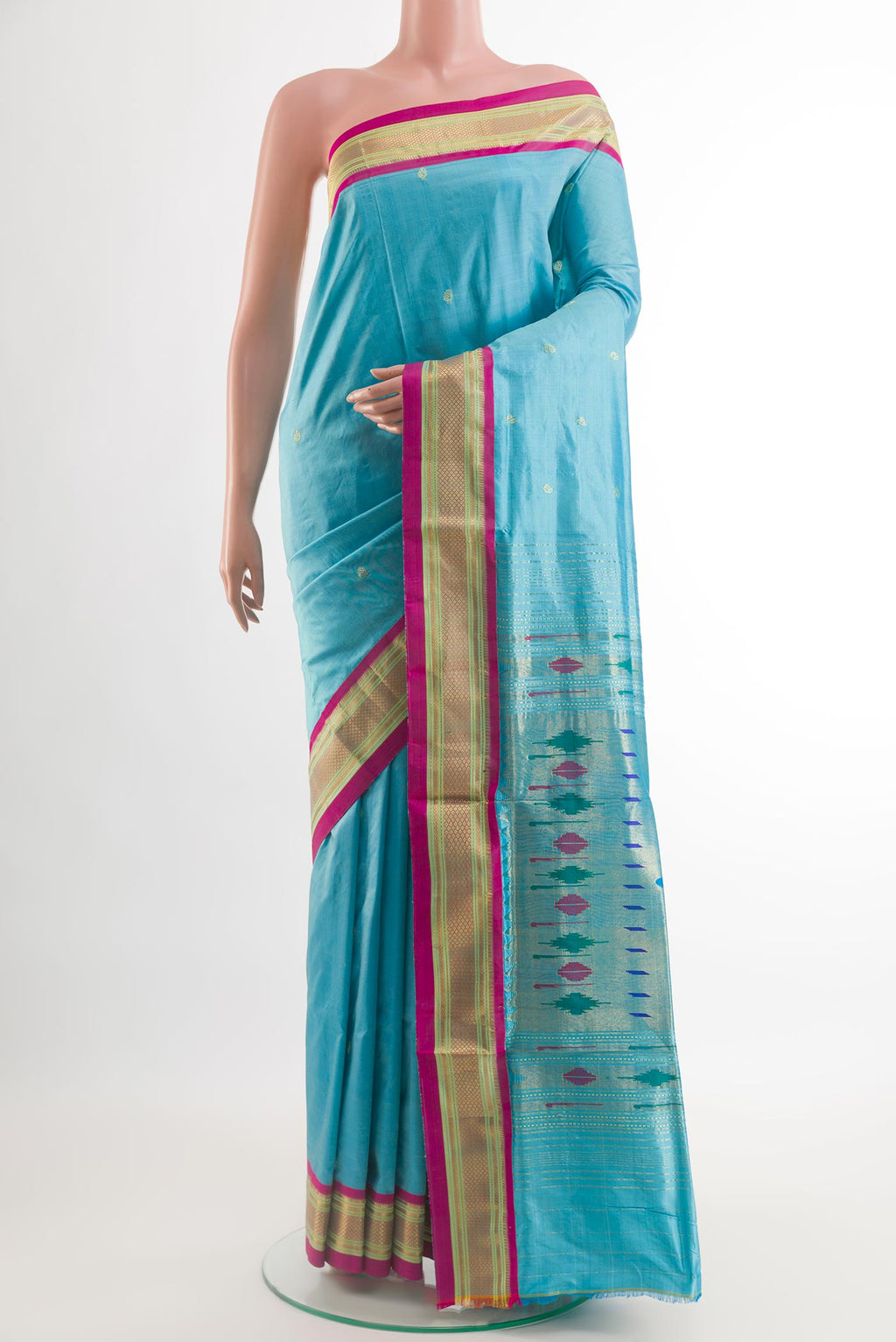 Blue Paithani Silk Saree with Zari Butta on the body and Zari Border.  displayed on a mannequin
