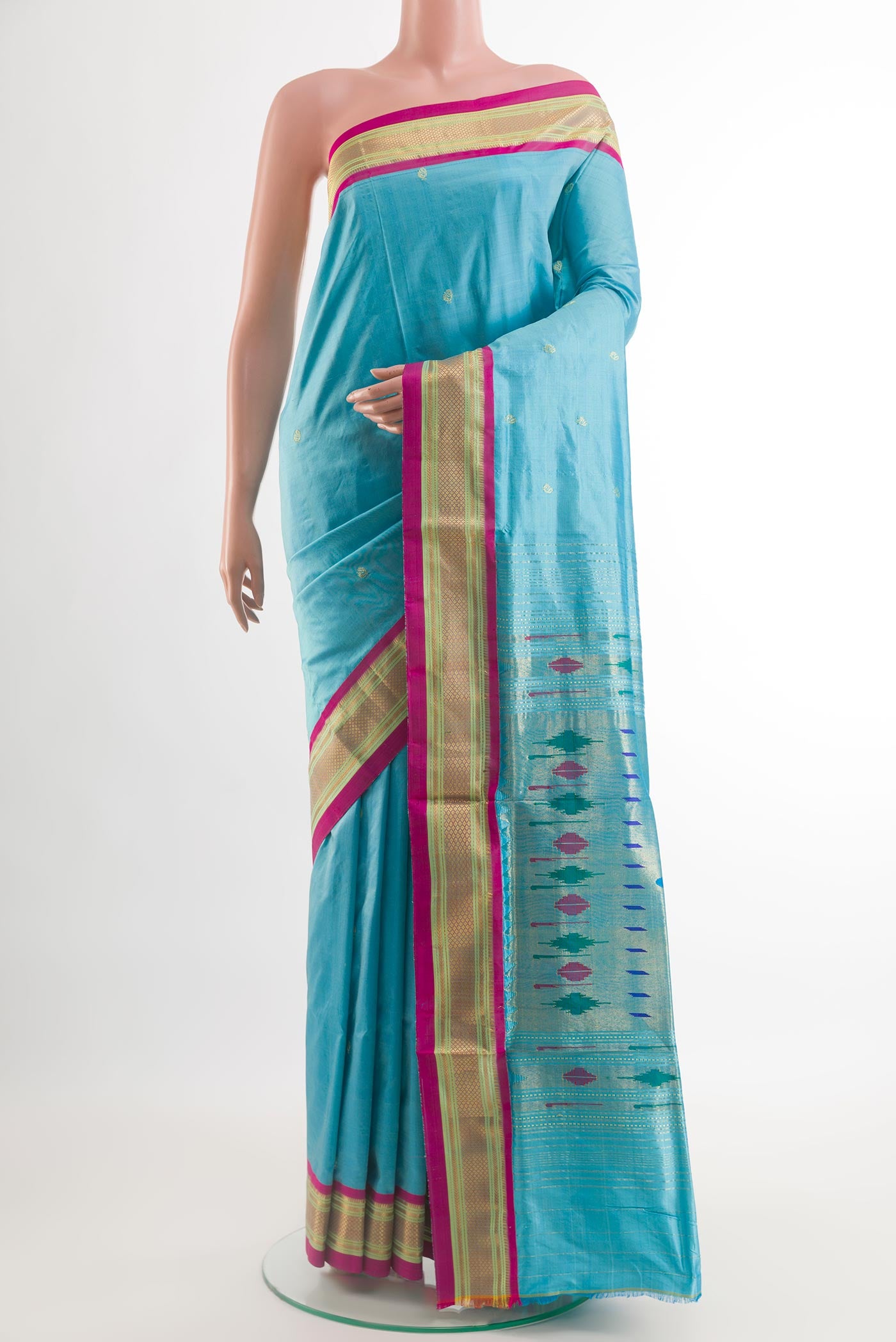 Blue Paithani Silk Saree with Zari Butta on the body and Zari Border.  displayed on a mannequin