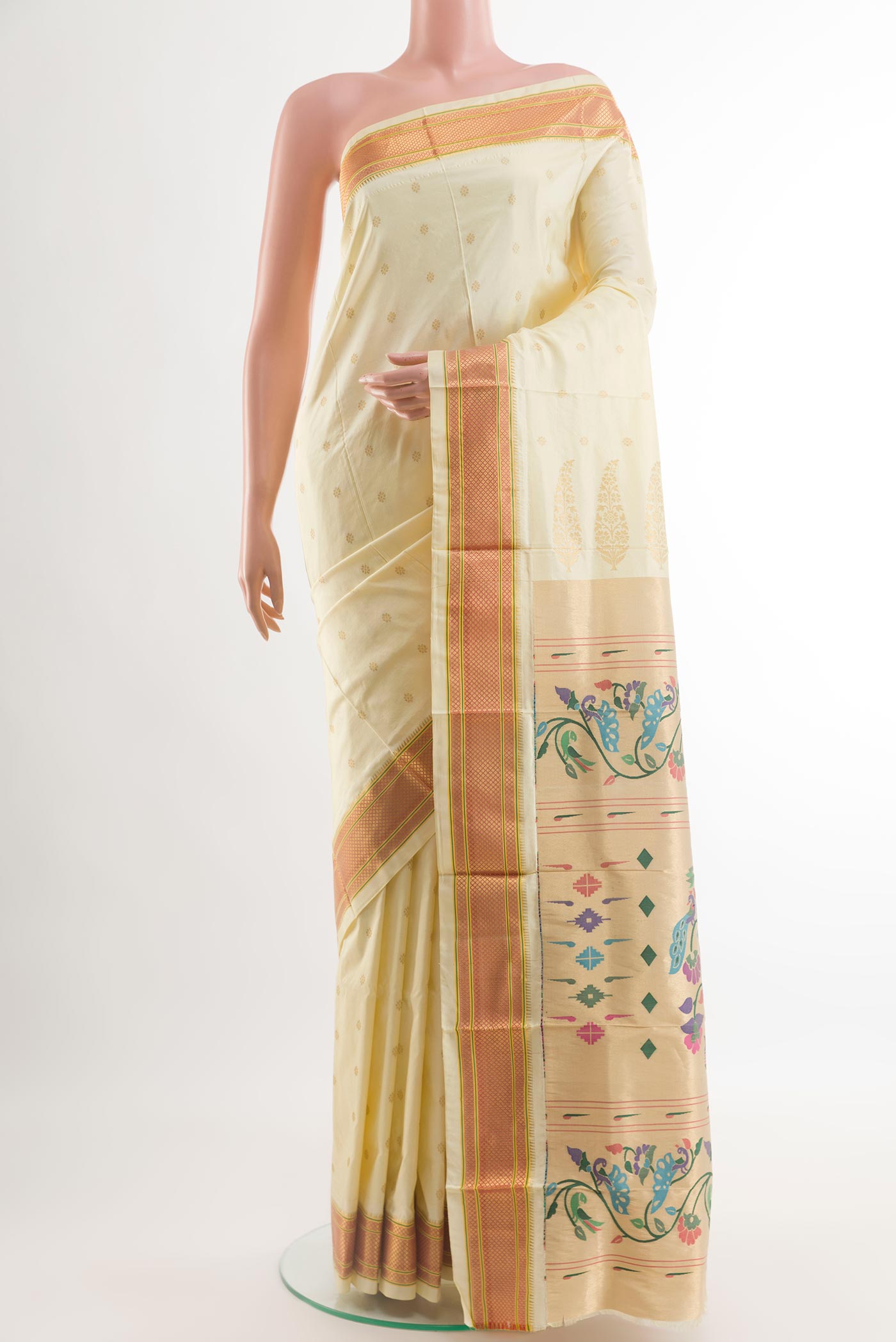 Off White Paithani Silk Saree with Zari Butta on the body and Paithani Border.  displayed on a mannequin