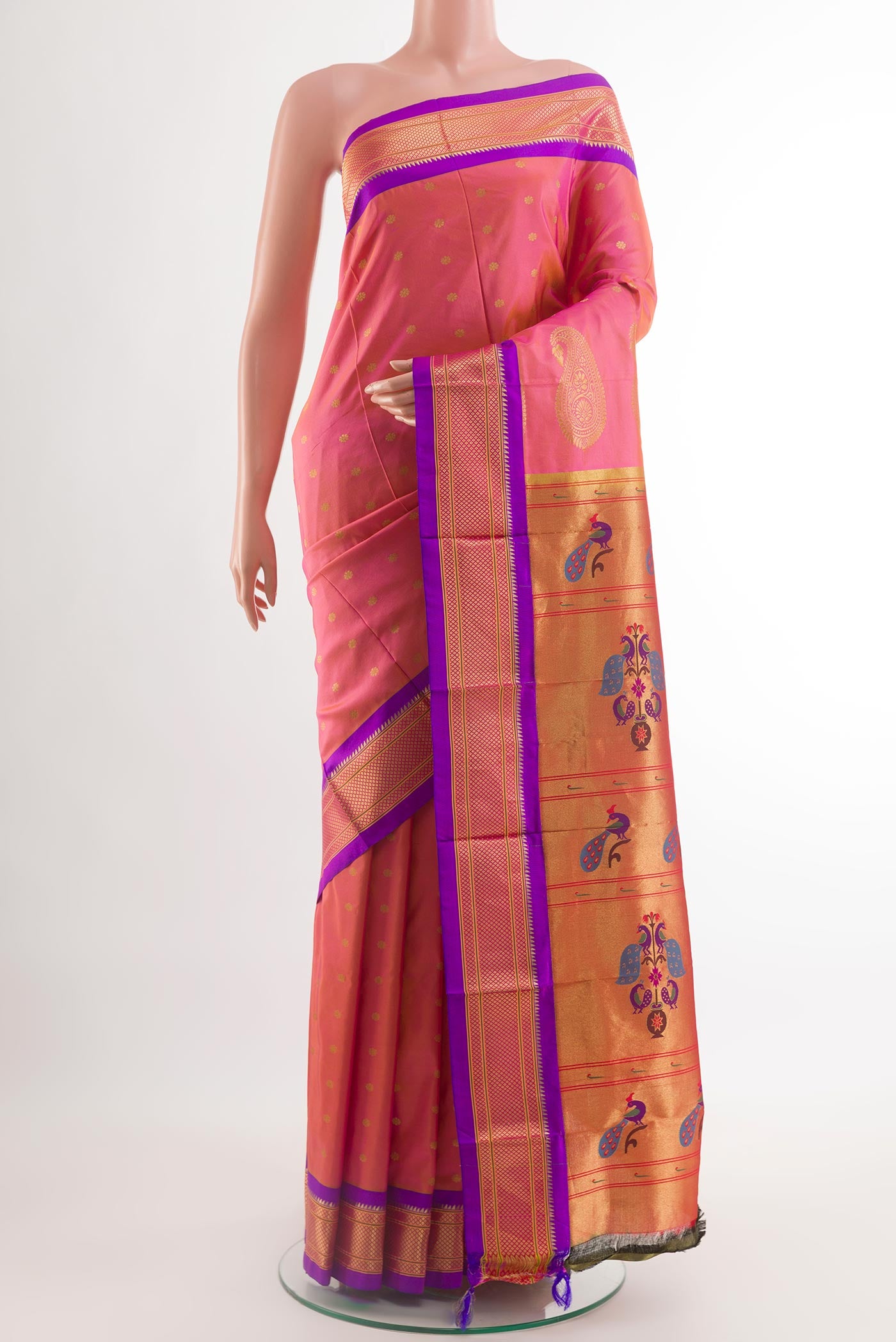 Peach Paithani Silk Saree with Zari Butta on the body and Zari Border.  displayed on a mannequin