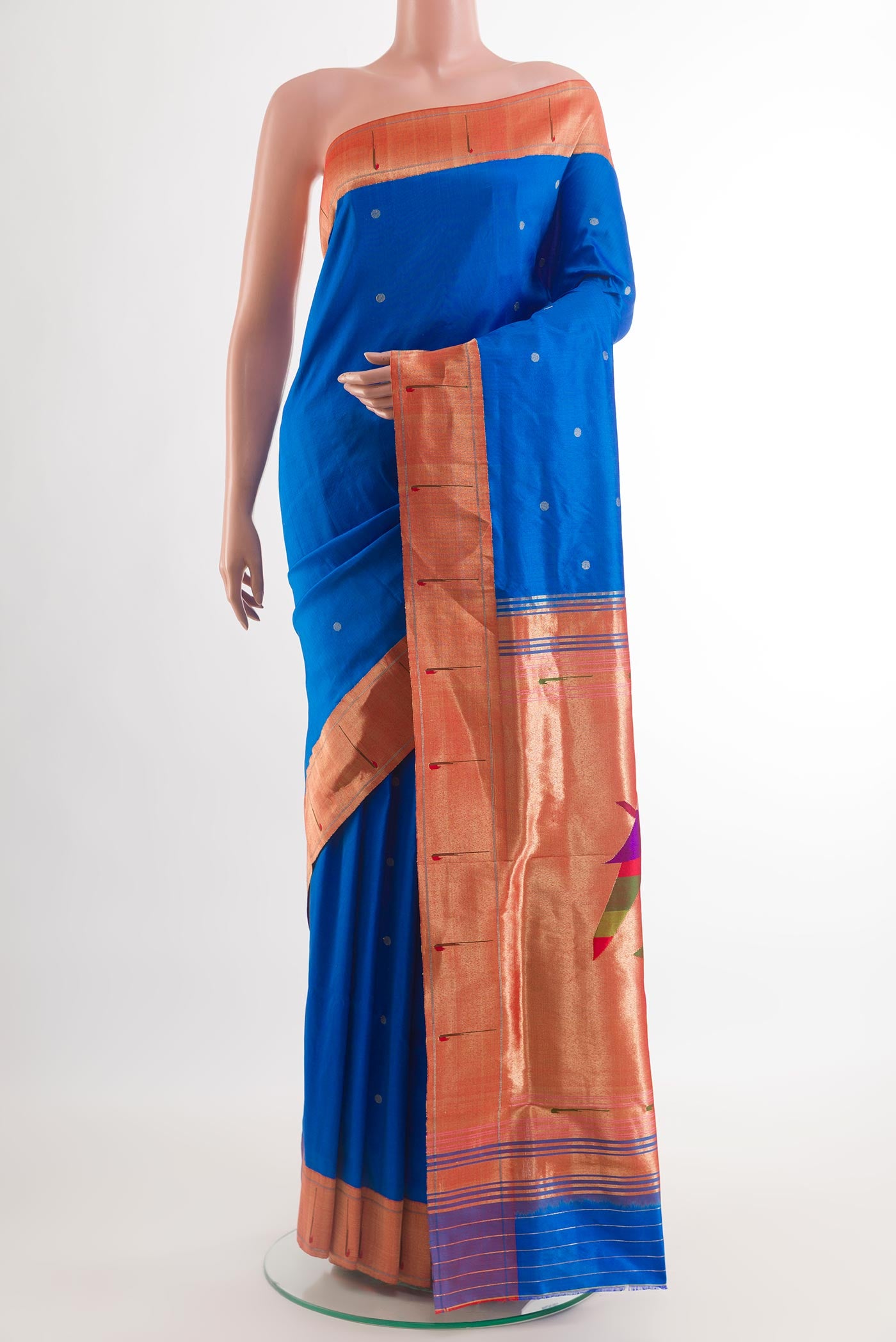 Blue Paithani Silk Saree with Zari Butta on the body and Zari Border.  displayed on a mannequin