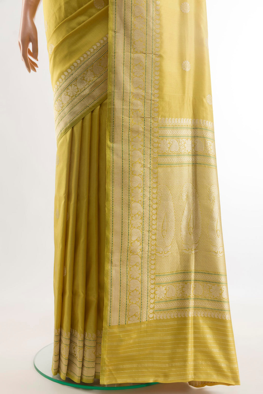 Pleats and pallu of Lemon Yellow Banarasi Silk Saree with Zari Butta on the body and Zari Border. 